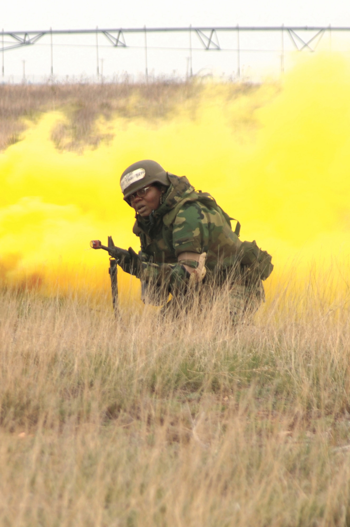Tech. Sgt. Tina Bryant, 27th Operations Support Squadron at Cannon Air Force, N.M., attacks an enemy bunker during Expeditionary Combat Skills training April 5-6. The two-day course is mandatory for Airmen deploying to the Central Air Force area of responsiblity. (Air Force photo by Senior Airman Heather Redman)