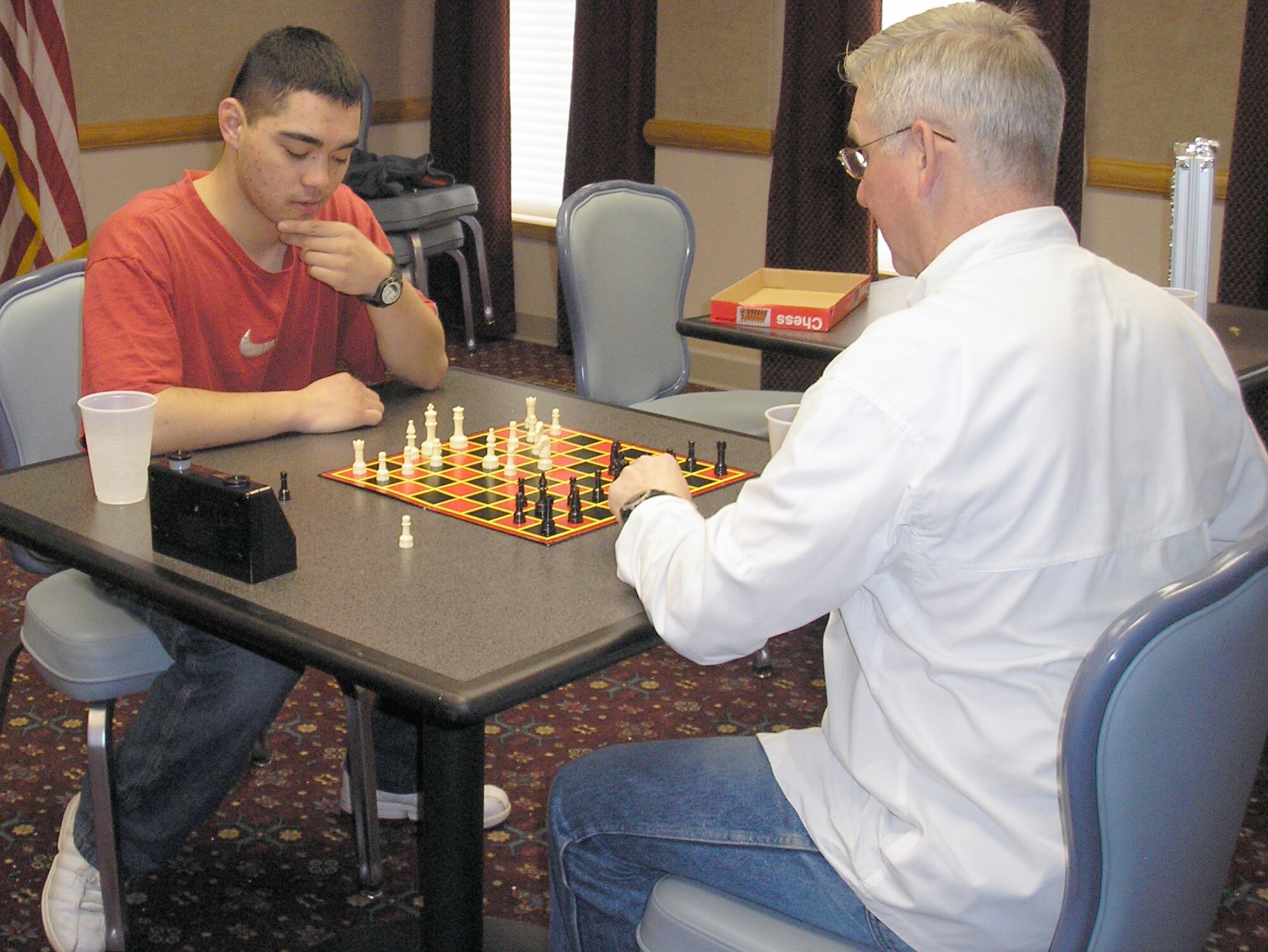 Senior Airman Peter Fles, 790th Missile Security Forces Squadron, pauses to consider his next move against Chaplain (Lt. Col.) Doug Arendsee, Wyoming Air National Guard, at the base chess tournament in the Trail’s End club March 10. First place went to Colonel Arendsee, 2nd place and the Warren representative at the Air Force Space Command chess competition was Airman Fles, and 3rd place was 1st Lt. Adam Weber, 90th Contracting Squadron.
(Courtesy photo)
