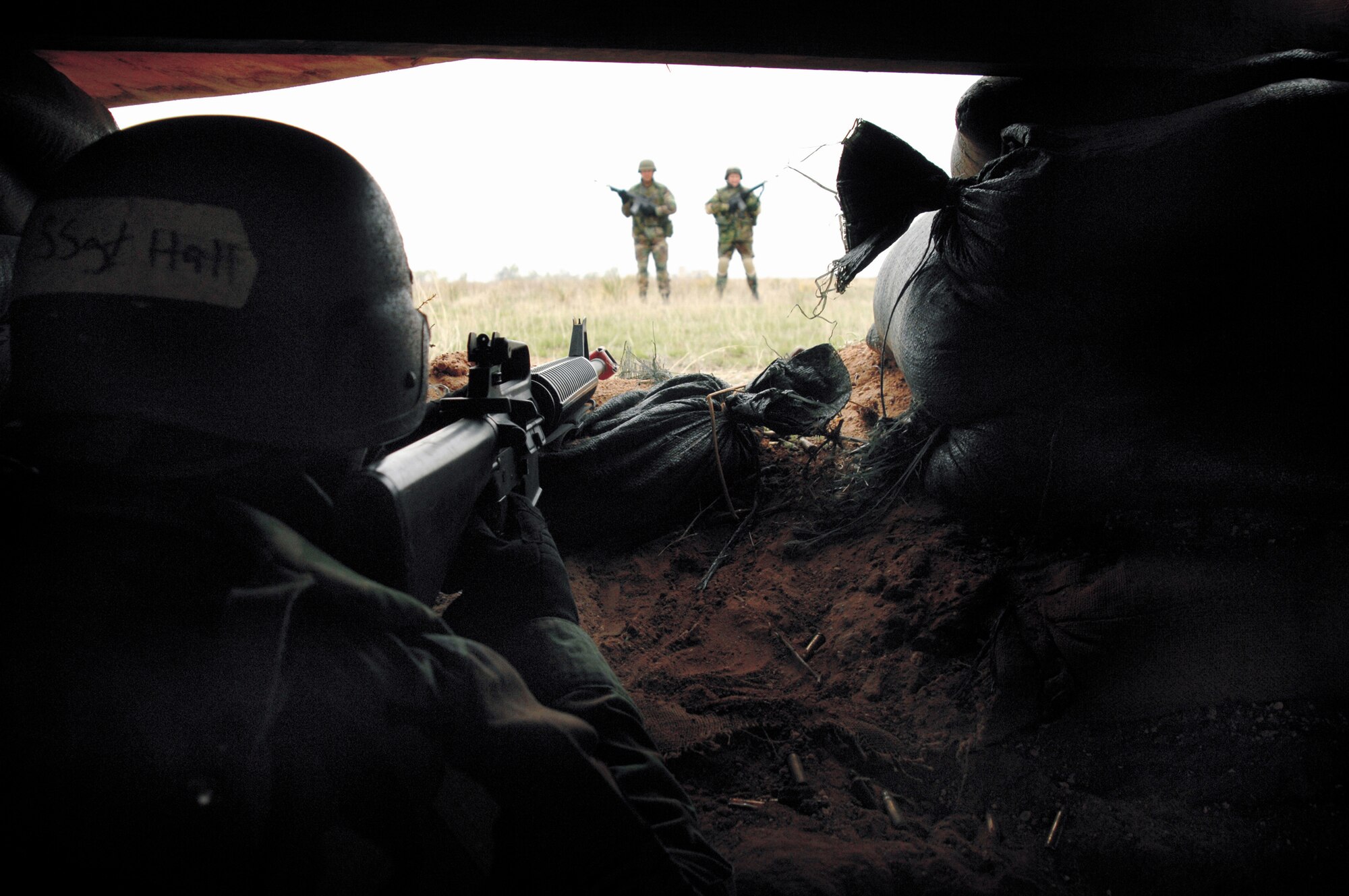 Staff Sgt. Jonathan Hall, 27th Services Squadron, maintains a defensive fighting position in a bunker during Expeditionary Combat Skills training April 5-6.Airmen going to a Central Air Force area of responsibility must complete ECS training before departure. (Air Force photo by Senior Airman Heather Redman)