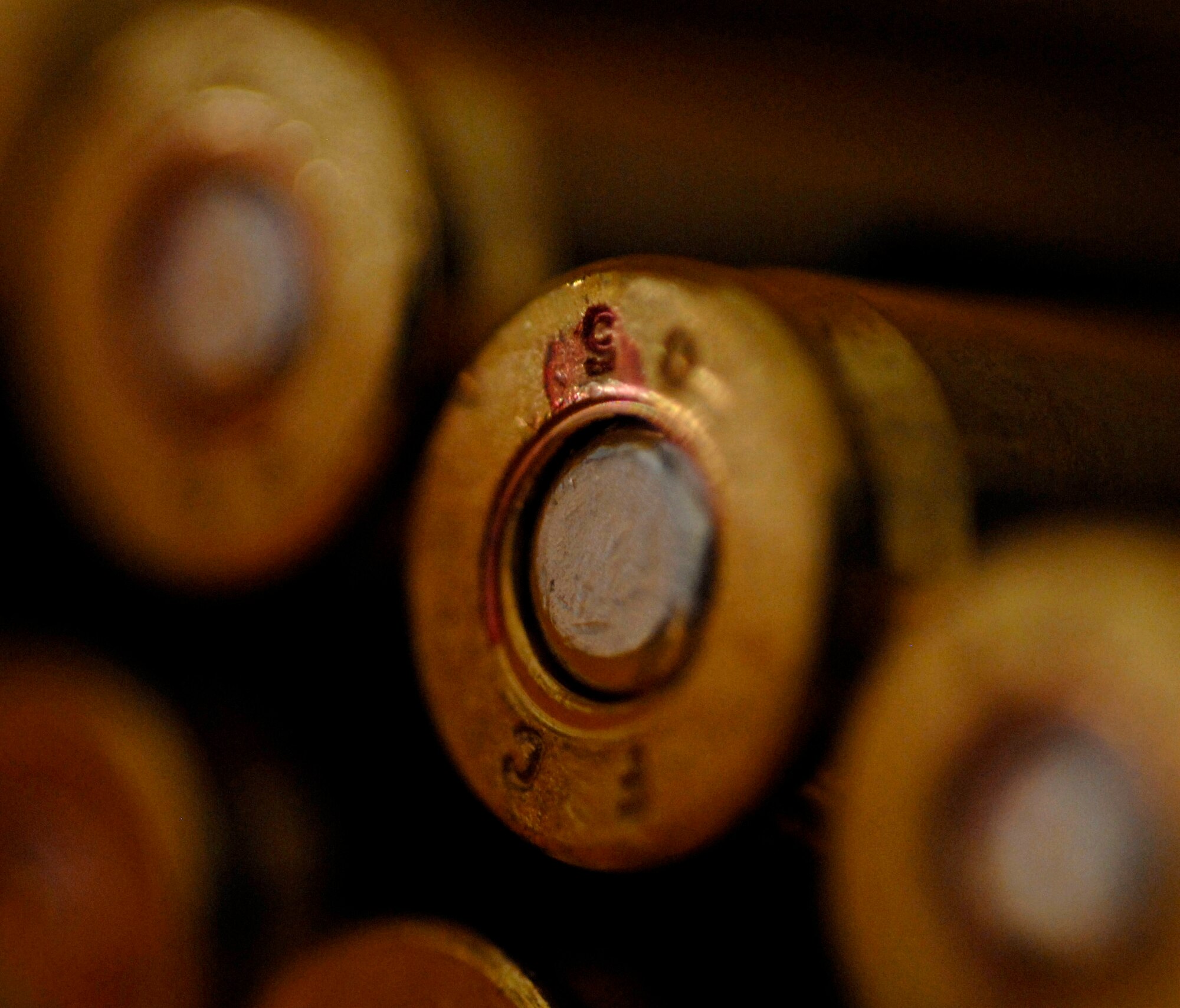 Unused 5.56mm rounds wait to be loaded into an M-16 during a tactical rifle qualification course April 12 at Luke Air Force Base, Ariz. Airmen must be qualified in their primary weapon prior to deploying in support of the war on terrorism. There are more than 28,000 Airmen deployed around the world today. .(U.S. Air Force photo/Senior Airman Christopher Hummel)