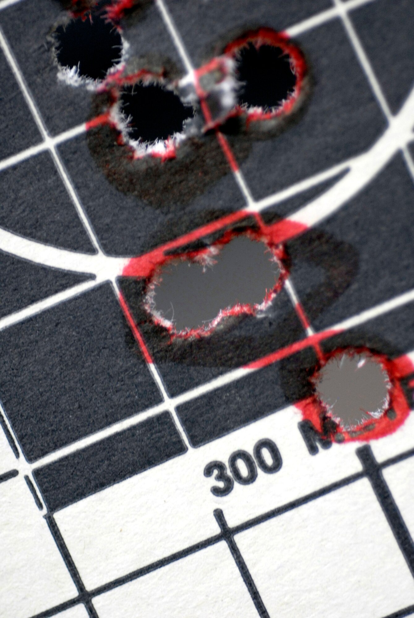 A standard target used for rifle qualification shows the grouping of rounds hit April 12 at Luke Air Force Base, Ariz. Airmen must be qualified in their primary weapon prior to deploying in support of the war on terrorism. There are more than 28,000 Airmen deployed around the world today. (U.S. Air Force photo/Senior Airman Christopher Hummel)
