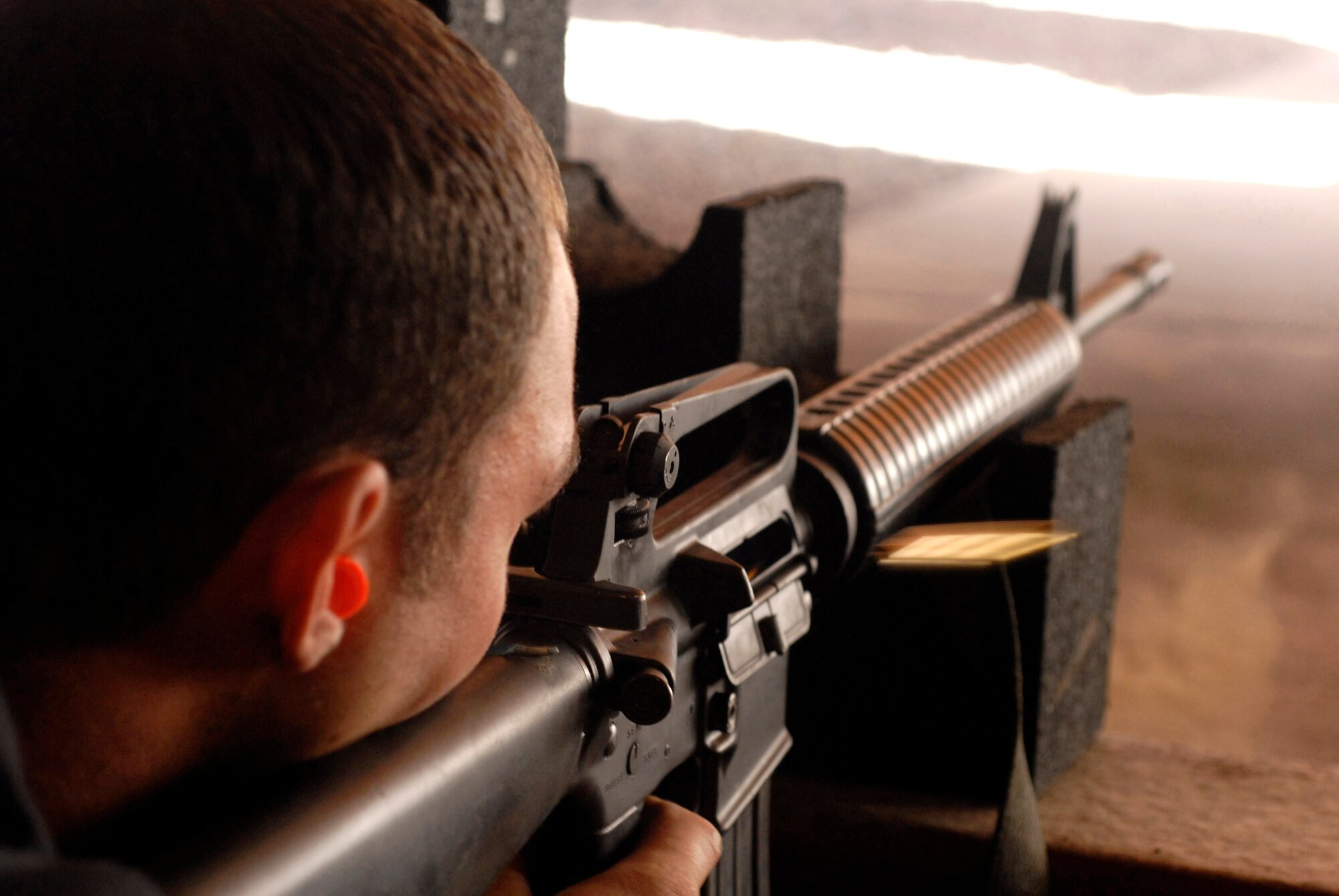 Senior Airman Duane Gross fires his M-16 during a tactical rifle qualification course April 12 at Luke Air Force Base, Ariz. Airman Gross is assigned to the 756th Aircraft Maintenance Squadron. Airmen must be qualified in their primary weapon prior to deploying in support of the war on terrorism. There are more than 28,000 Airmen deployed around the world today. (U.S. Air Force photo/Senior Airman Christopher Hummel)
