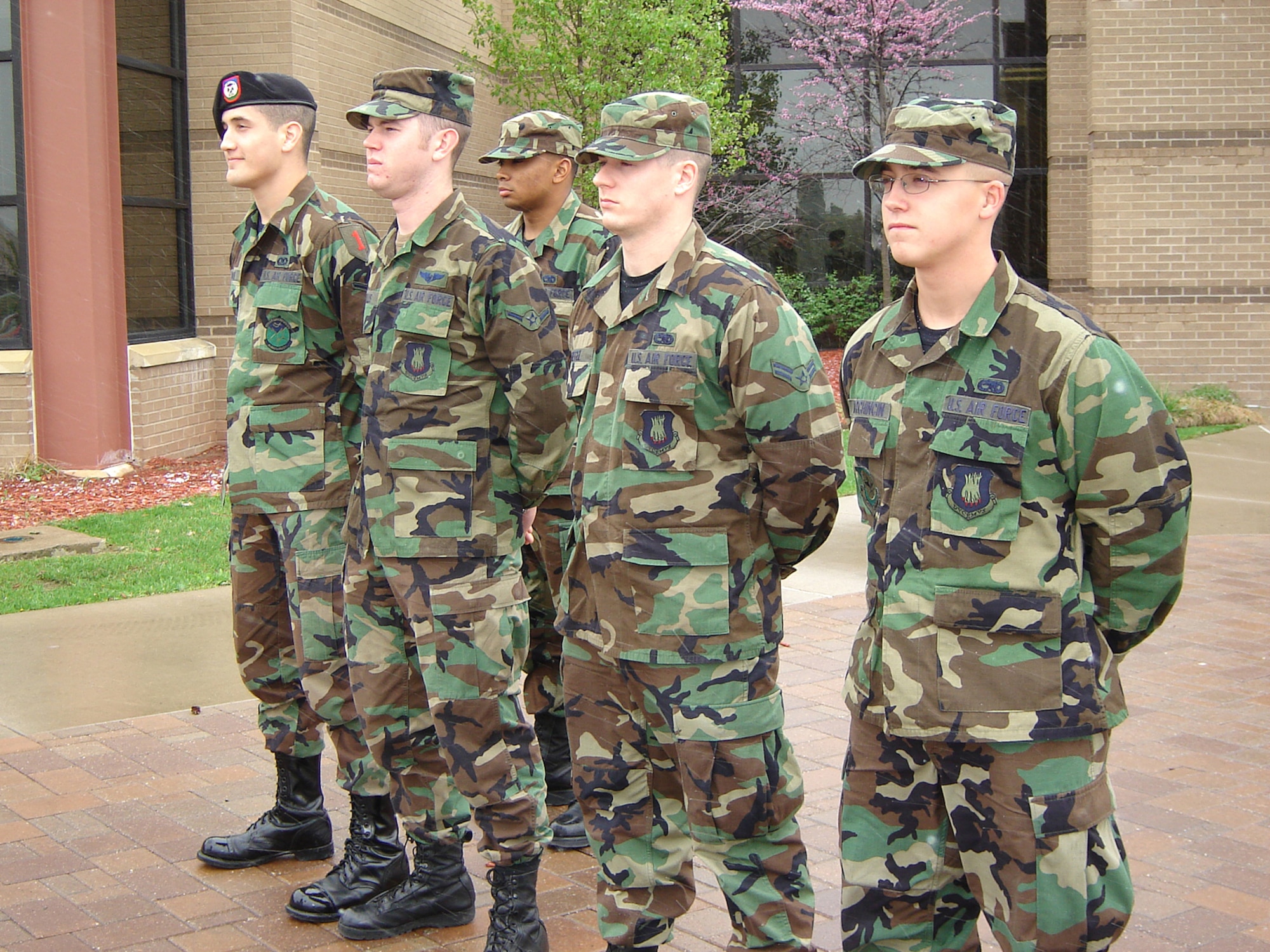 First Term Airman's Center students render proper customs and courtesies April 6 during a Retreat ceremony at the Dole Center flag pole. Airmen are outside and in uniform during Retreat should face the flag, or the sound of music, and stand at the position of parade rest. Then, upon the first note of the national anthem, Airmen should snap to attention and salute. Airmen remain in this position until the last note or music sounds. People driving around base when Retreat begins to play should bring their vehicles to a complete stop and sit quietly at attention until the last note of music plays. Airman in civilian clothes who are on base and outdoors during Retreat, should stand at attention and place their right hands over their hearts upon the first note of the national anthem. Airmen in civilian clothes and wearing hats should hold their hats in their right hands over their hearts during the national anthem. (Photo by Airman 1st Class Jessica Lockoski)