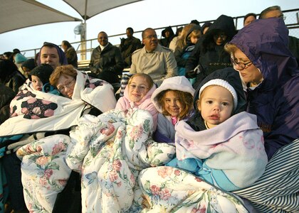 Attendees of the Easter Sunrise Service at the Lackland Air Force Base, Texas, parade ground on April 8 bring blankets and coats to fight off the morning chill. More than 270 people attended the early morning service. (USAF photo by Robbin Cresswell) 