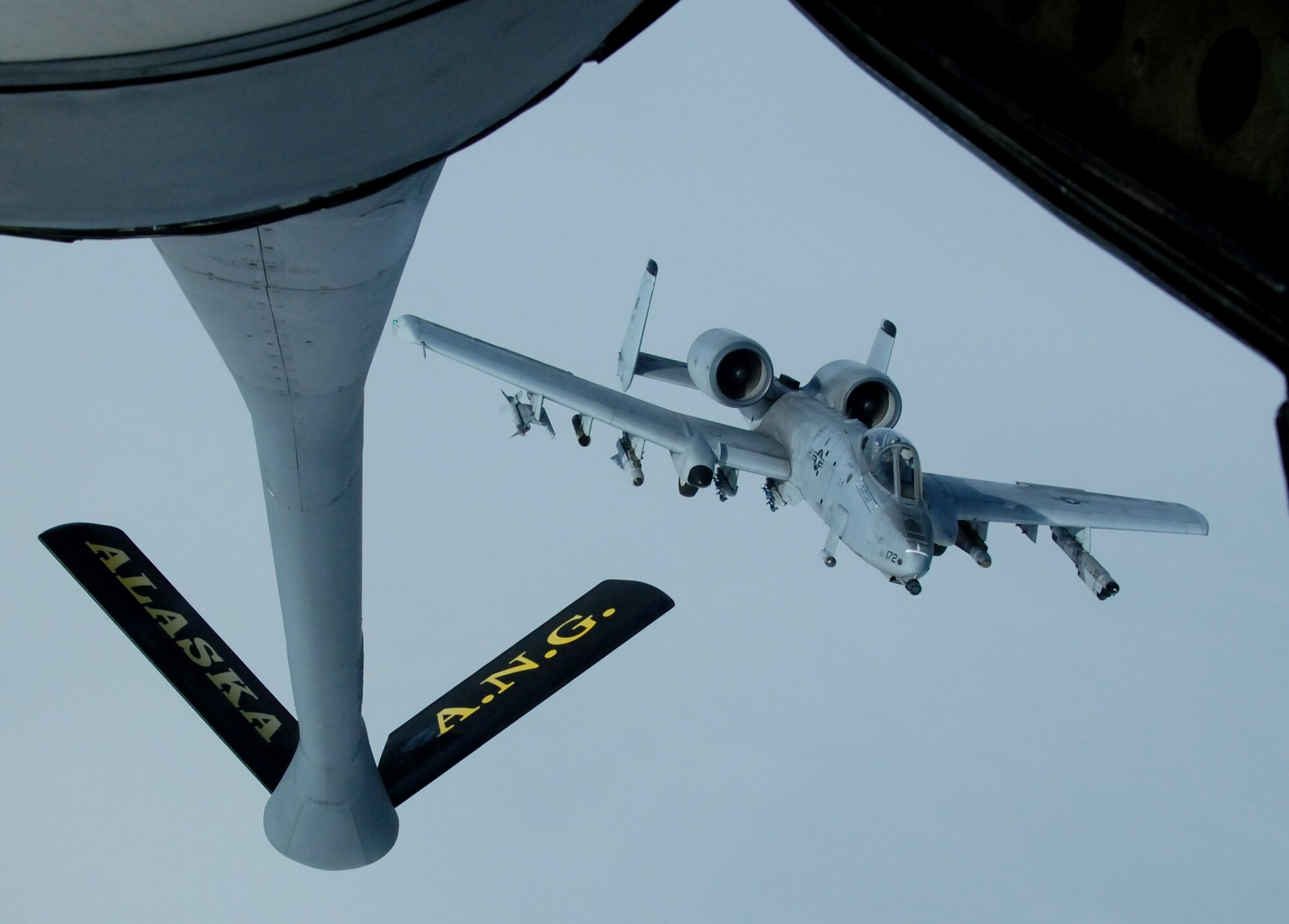 Capt. Oliver Rick moves his A-10 Thunderbolt II into position behind a KC-135 Stratotanker April 4 over the Pacific Alaska Range Complex.  Captain Rick, a 355th Fighter Squadron pilot from Eielson Air Force Base, Alaska, was participating in a live-fire exercise.  (U.S. Air Force photo/Master Sgt. Robert Wieland)