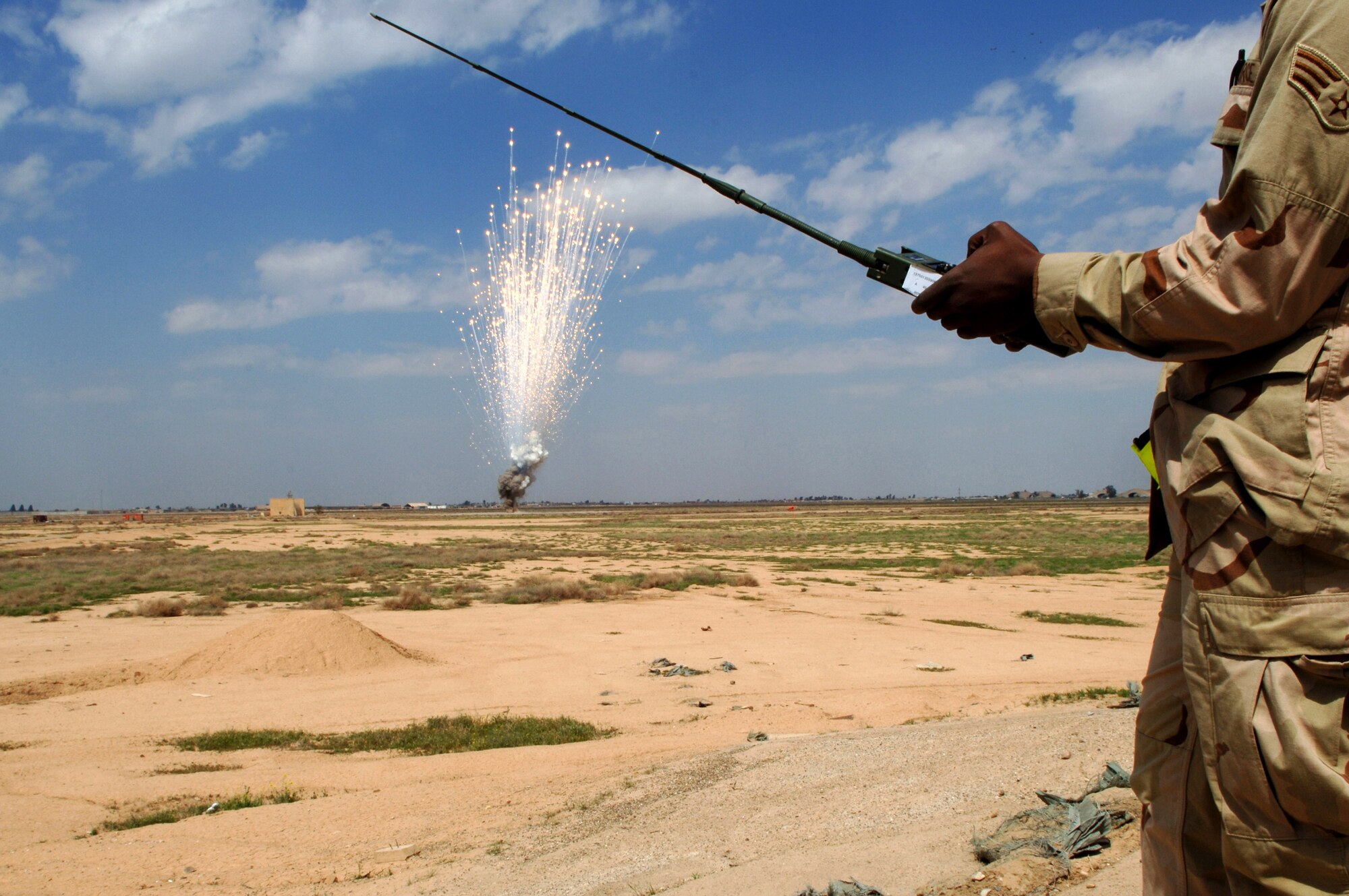 An Airman with the 332nd Expeditionary Civil Engineer Squadron's Explosive Ordnance Disposal Flight at Balad Air Base, Iraq, safely detonates unserviceable, excess and dangerous ordnance. (U. S. Air Force photo/Staff Sgt. Michael R. Holzworth)
