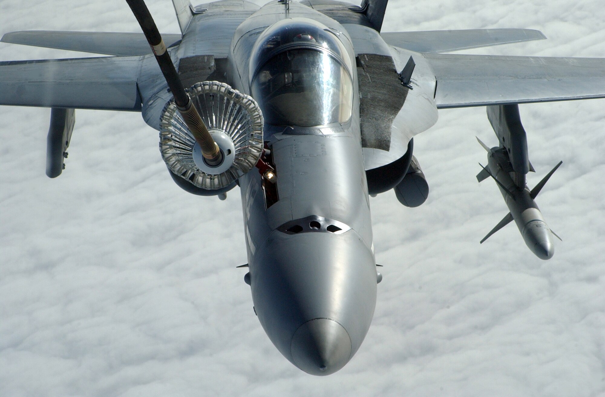 A Navy F/A-18 Hornet receives fuel from a KC-10 Extender's trailing drogue during Red Flag-Alaska 07-1 April 11. Red Flag-Alaska is a Pacific Air Forces-directed field training exercise for U.S. forces flown under simulated air combat conditions. It is conducted on the Pacific Alaskan Range Complex with air operations flown out of Eielson and Elmendorf Air Force Bases. (U.S. Air Force photo/Senior Airman Justin Weaver).