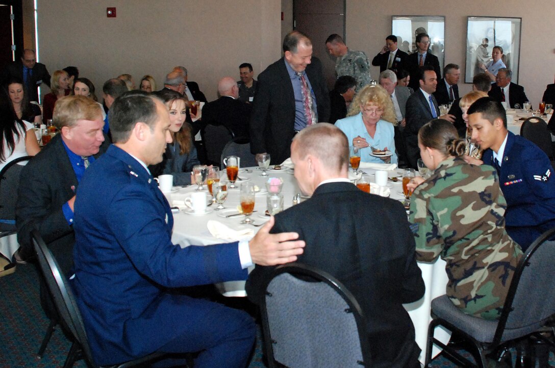 Servicemembers gather with Arizona business and political leaders in Phoenix for the presentation of the Office of the Secretary of Defense Exceptional Public Service Award on April 12. The award was presented to the city of Peoria, Ariz., in recognition of the city's support of troops. Defense Dept. photo by Samantha L. Quigley