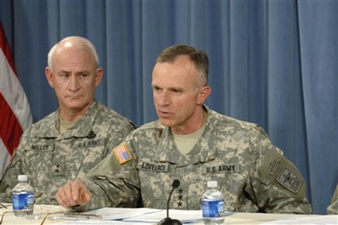 Deputy Chief of Staff Lt. Gen. James L. Lovelace (right) responds to a reporter's question as Deputy Chief of Staff for the U.S. Army Forces Command Maj. Gen. Thomas G. Miller (left) looks on during a Pentagon press conference on April 12, 2007.  Army senior operations leaders conducted the briefing to give details of the active-duty troop extensions for the Central Command area of operations.   