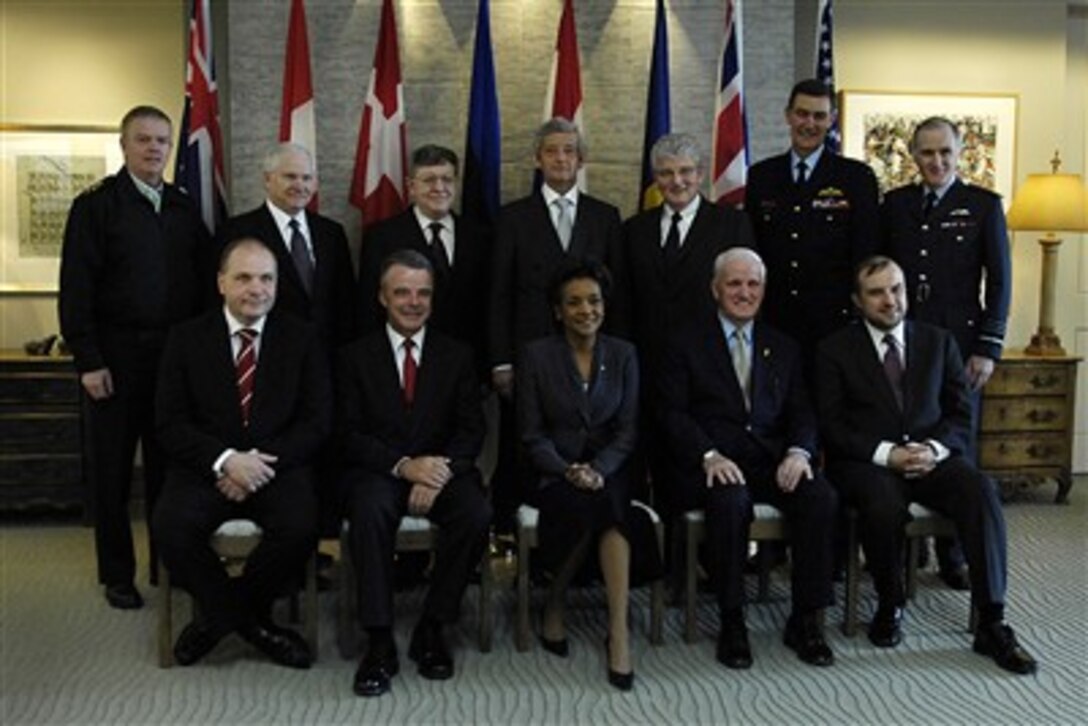 Defense Secretary Robert M. Gates, back second from left, takes a group photo with defense ministers and Governor General of Canada Michaelle Jean, front center, prior to the start of the Regional Command South Defense Ministers Conference in Quebec, Canada, April 12, 2007.  