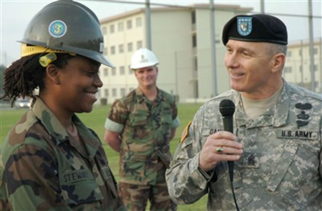 Army Sgt. Maj. William J. Gainey, senior enlisted advisor to the Chairman of the Joint Chiefs of Staff, talks with a construction electrician. Gainey, who is the most senior enlisted servicemember in the Department of Defense, is on a week-long visit to military installations in Okinawa. U.S. Navy photo by Petty Officer 2nd class Dustin Coveny 