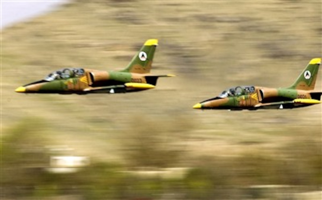 Afghan National Air Corps L-39 Albatross jets take off in a formation practice for the aerial parade in the upcoming Afghan National Day in Kabul, April 12, 2007. Air Force mentors assigned to Defense Reform Directorate Air Division under Combined Security Transition Command - Afghanistan provide guidance to soldiers with the Maintenance Operations Group for the ANAC.