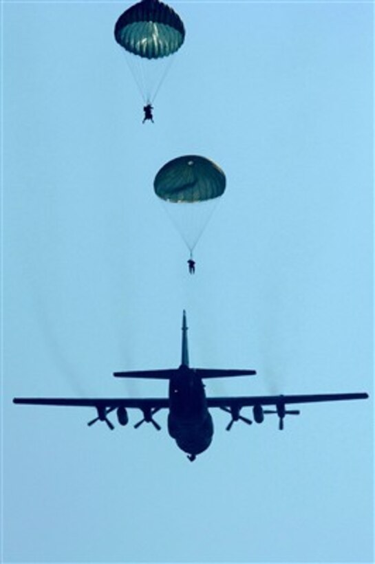 U.S. Air Force security forces airmen parachute from a C-130 Hercules aircraft during a joint Army-Air Force exercise over Southern Germany on April 11, 2007.  