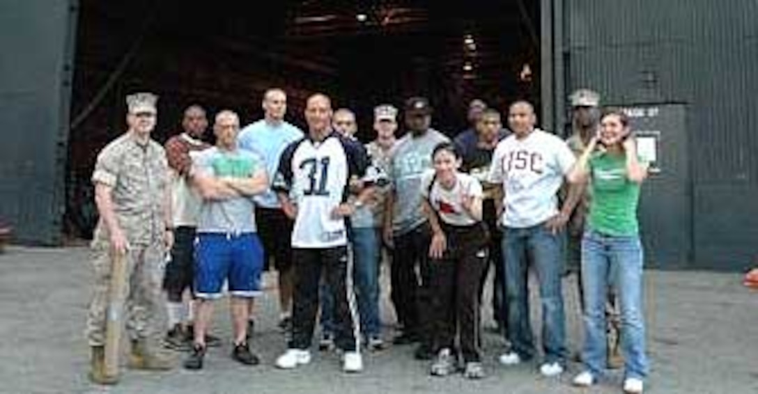 Cpl. Moratalla (far right) poses with a group of fellow Marines in front one of the filming studios at Universal Studios Hollywood.