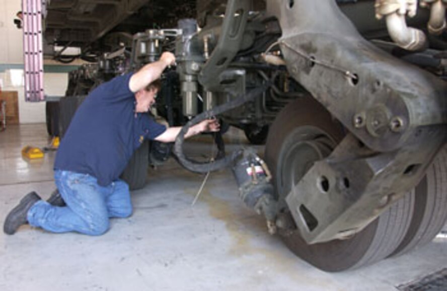 Tom Gillis, a contractor with Satellite Services, Inc. at March Air Reserve Base, Calif., practices what he learned in class on operating and maintaining the Tunner 60K. (U.S. Air Force photo by Staff Sgt. Amy Abbott)