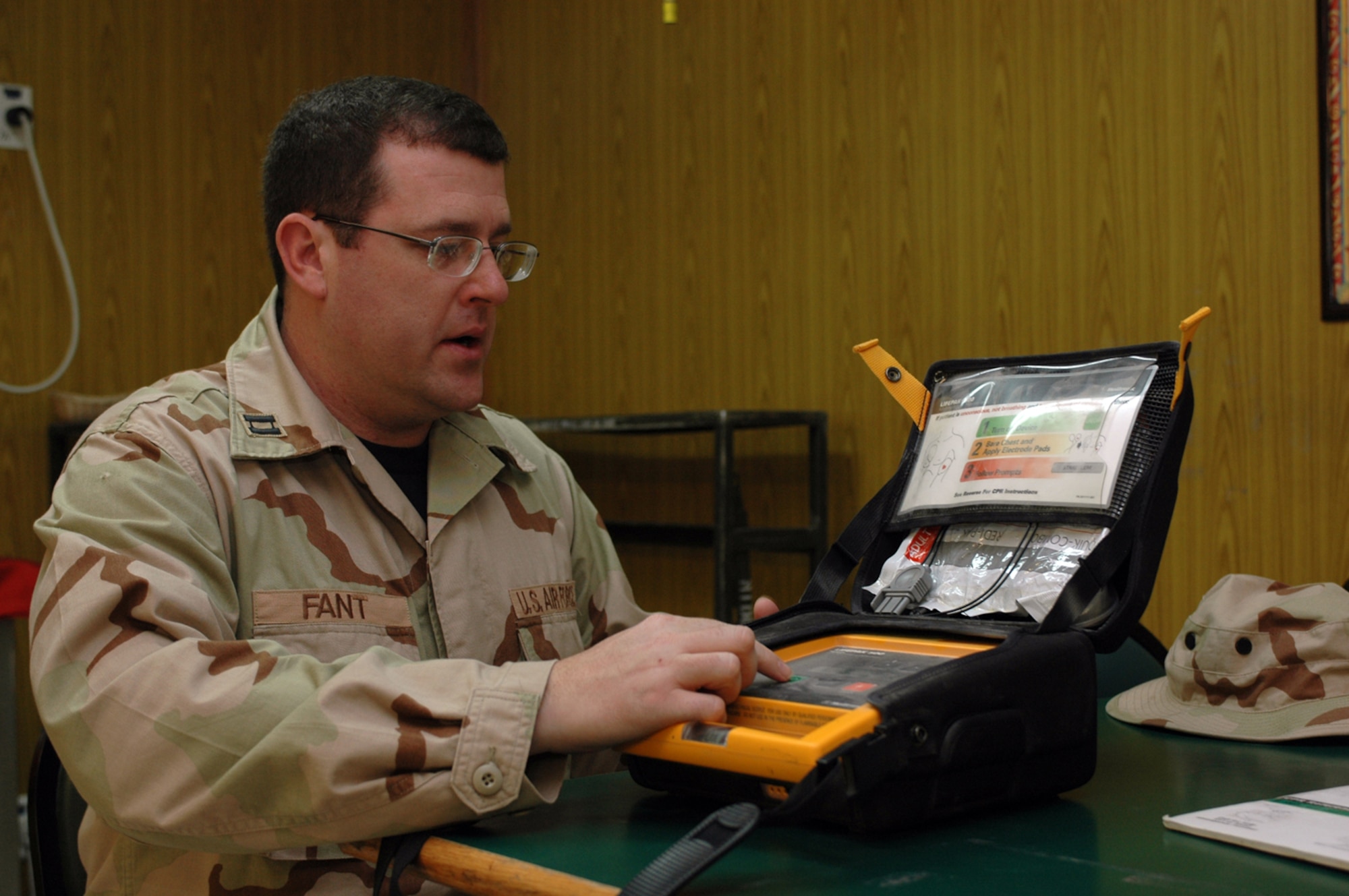 Capt. James Fant, 379th EMDG clinical nurse, performs a weekly inspection of the Automated External Defibrillator at the Independence Dining Facility. The shock delivered by an AED helped save an Airman’s life recently. (U.S. Air Force photo by Senior Airman Erik Hofmeyer)