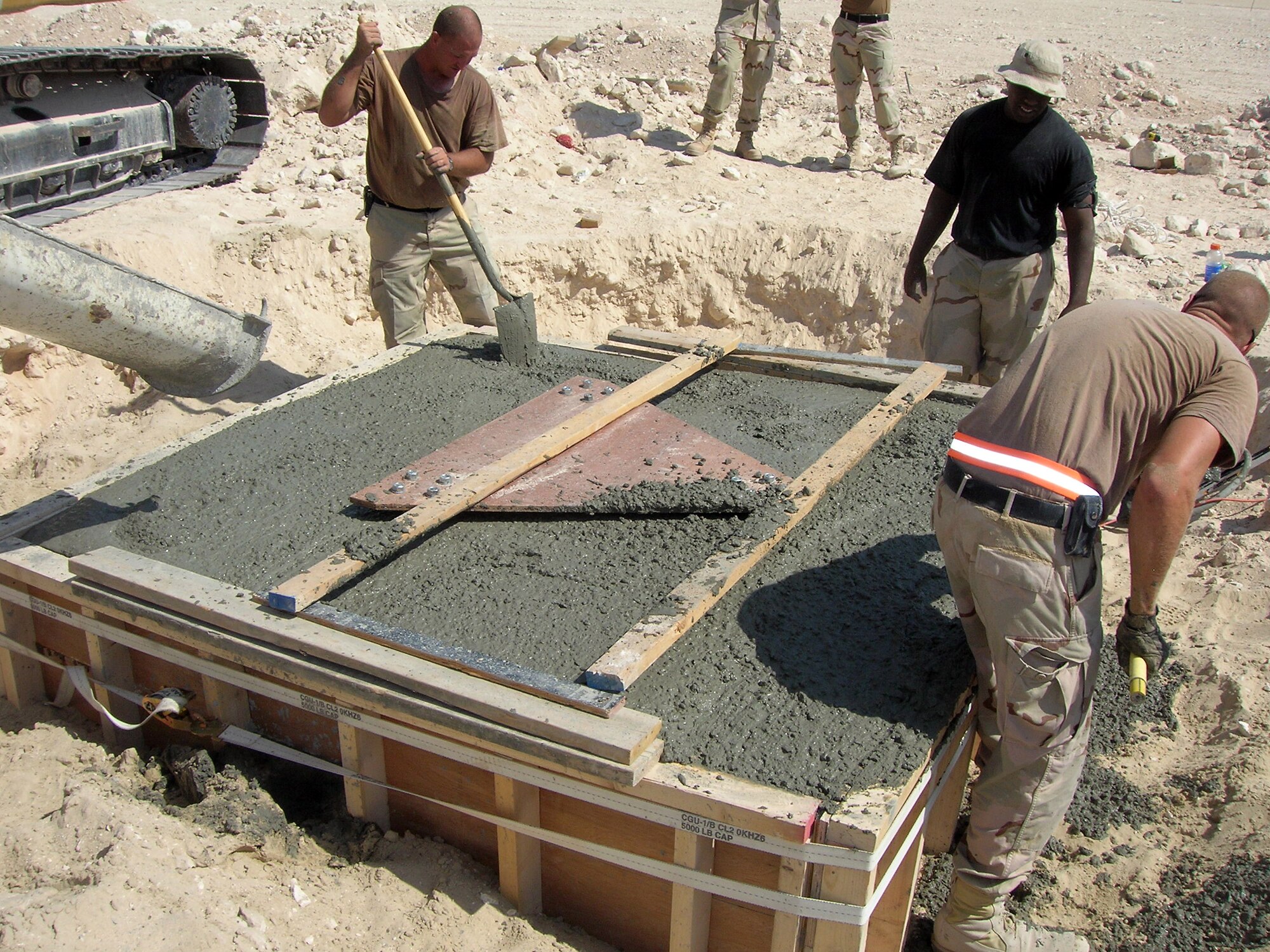Airmen from the 379th Expeditionary Civil Engineer Squadron Heavy Repair Flight construct a concrete pad foundation for the instrument landing system equipment. The ILS was recently certified, and will aid aircrews landing in low-visibility conditions. (U.S. Air Force photo/379th ECES)