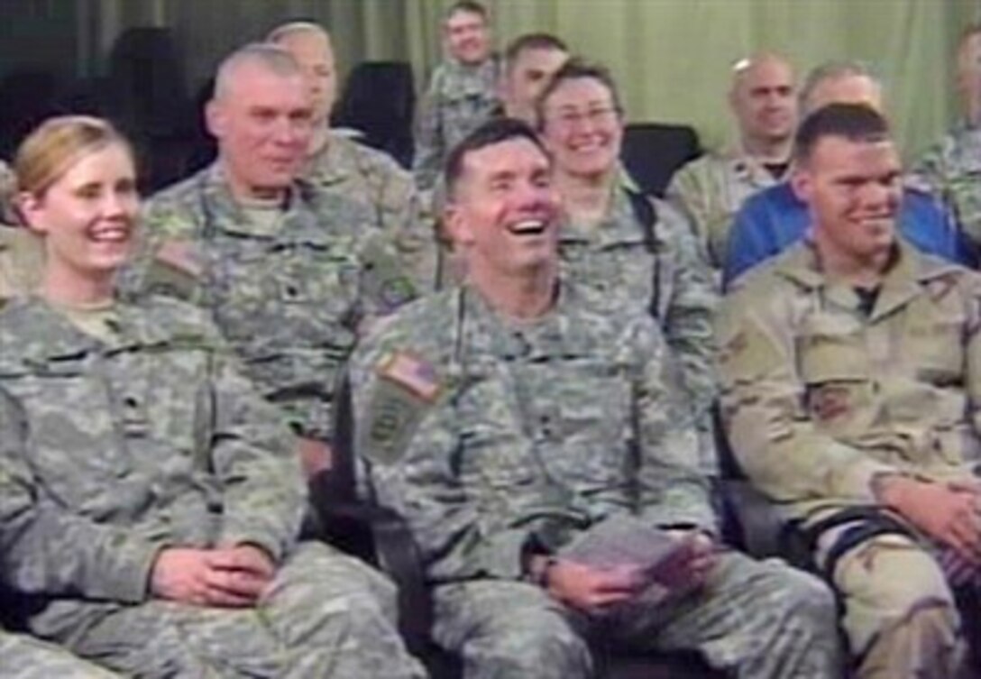 Multi-National Force-Iraq spokesperson Maj. Gen. William Caldwell shares a laugh with deployed servicemembers in Baghdad via satellite during the annual Hearts to Heroes event in Phoenix, Ariz., April 14, 2007.