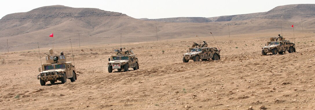 COMBAT OUTPOST RAWAH, IRAQ – Iraqi Soldiers travel with Company C, 1st Light armored Vehicle Battalion, Regimental Combat Team 2, to patrol the western Euphrates River valley. The company, who call themselves Warpigs, has been conducting joint operations with the Iraqi Army for several weeks. Official Marine Corps Photo By Lance Cpl. Ryan C. Heiser.