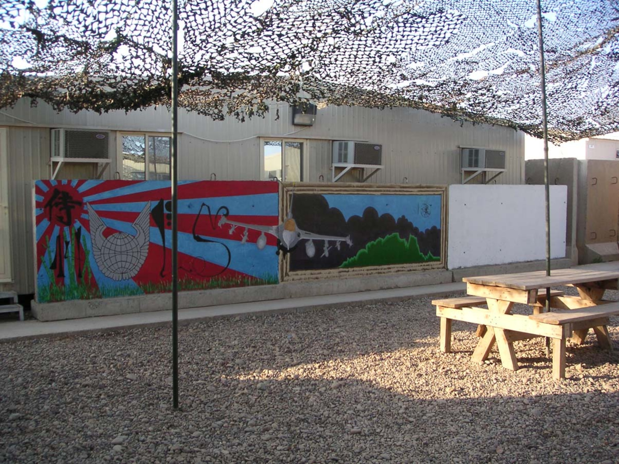070412--BALAD AIR BASE, Iraq -- Another Misawa Airman, Airman Anthony Dragich, 14th Fighter Squadron, used some of his time to be creative. Murals on barriers can be seen throughout Balad. (Courtesy photo)
