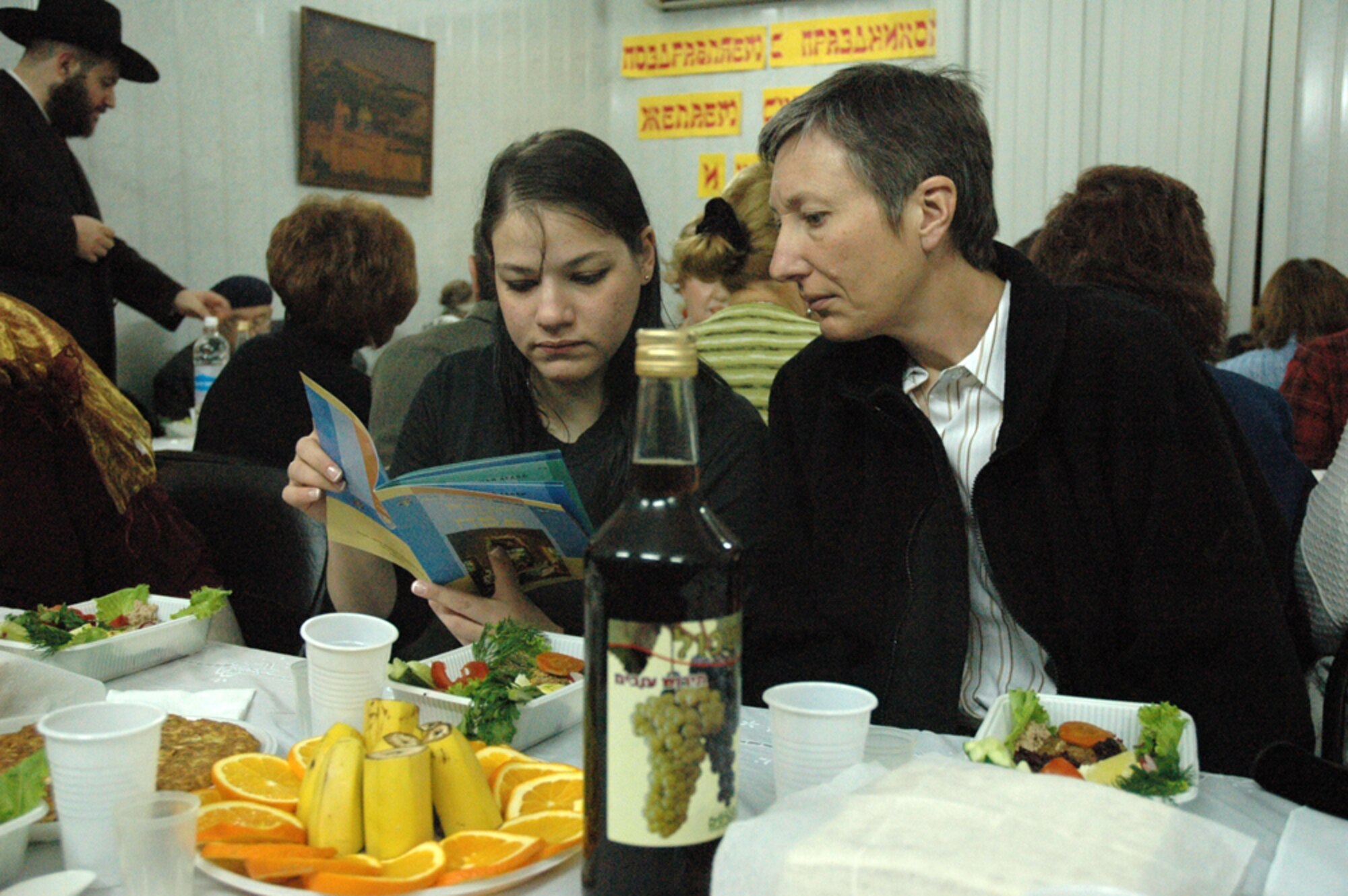 Airman 1st Class Rochel Leah Goldblatt shares Passover withTech. Sgt. Christine Paille at a Jewish Community Center in Bishkek, Kyrgyzsrtan. The Manas Air Base Chapel Staff worked closely with Force Protection, the Wing Leadership, and a local Synagogue to arrange for Jewish personnel to take part in the Passover service. (Air Force Photo/Master Sgt. Daniel Nathaniel)