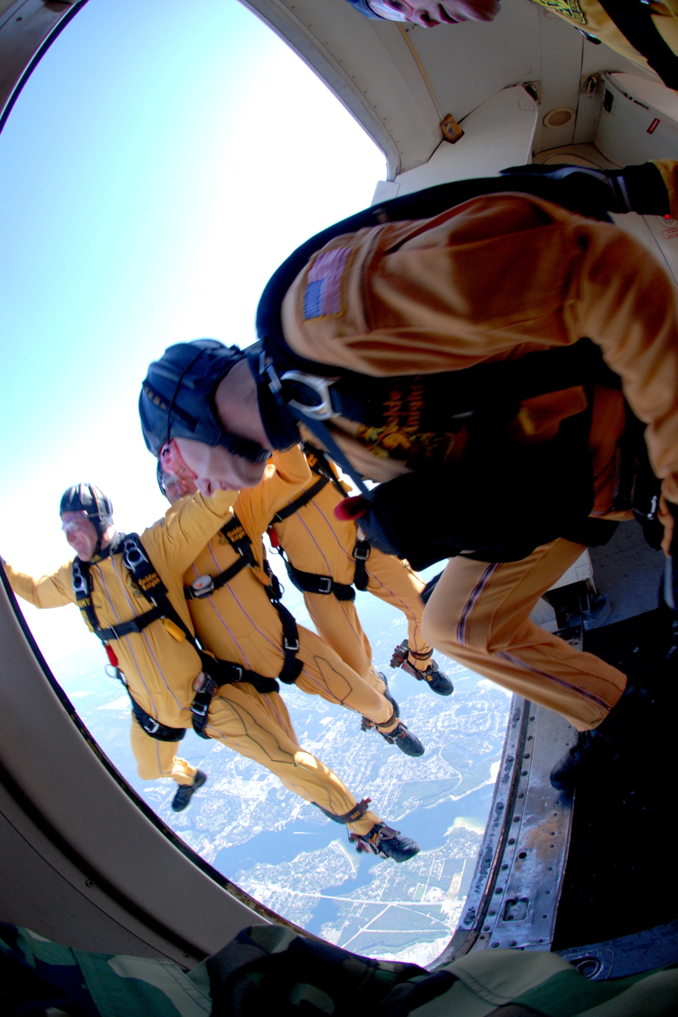 OVER EGLIN AIR FORCE BASE, Fla. -- U.S. Army Cpl. Ben Borger follows Sgt. Ryan Ray, Sgt. 1st Class Paul Sachs and Sgt. Drew Starr, all members of the U.S. Army Parachute Team "Golden Knights" black team, during a jump at the air show practice April 14. The practice show was the only jump the team made due to an April 15 severe weather cancellation of the air show and winds exceeding 20 mph gusts April 16. (U.S. Air Force photo by Staff Sgt. Mike Meares)