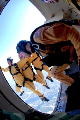 OVER EGLIN AIR FORCE BASE, Fla. -- U.S. Army Cpl. Ben Borger follows Sgt. Ryan Ray, Sgt. 1st Class Paul Sachs and Sgt. Drew Starr, all members of the U.S. Army Parachute Team "Golden Knights" black team, during a jump at the air show practice April 14. The practice show was the only jump the team made due to an April 15 severe weather cancellation of the air show and winds exceeding 20 mph gusts April 16. (U.S. Air Force photo by Staff Sgt. Mike Meares)