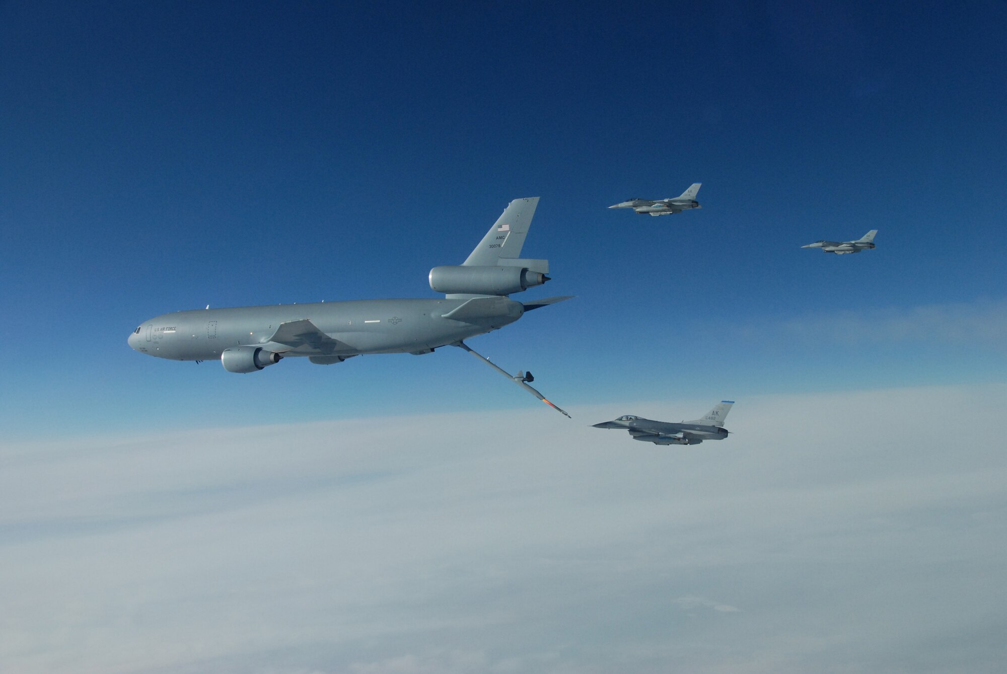 EIELSON AIR FORCE BASE, Alaska--Three F-16 Fighting Falcons from the 18th Fighter Squadron refuel behind a KC-10 Extender over the Pacific Alaska Range Complex during Red Flag-Alaska 07-1. Red Flag-Alaska is a Pacific Air Forces-directed field training exercise for U.S. forces flown under simulated air combat conditions. (U.S. Air Force photo by Master Sgt. Robert Wieland)