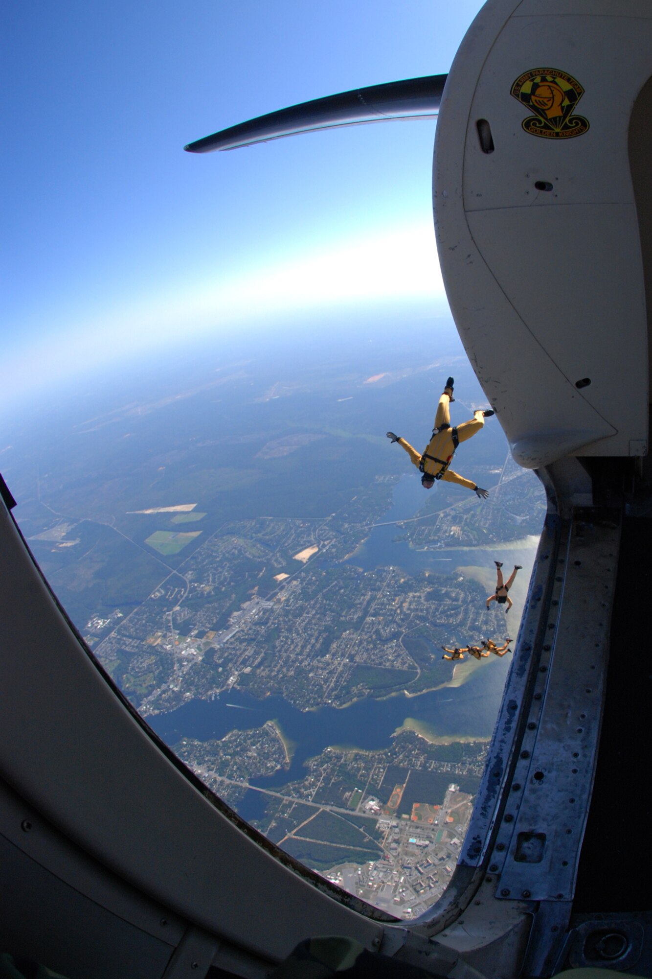OVER EGLIN AIR FORCE BASE, Fla. -- U.S Army Sgt. Matt Acord is the last to lave the starboard side of the U.S. Army Parachute Team "Golden Knights" C-41 during a jump at the air show practice April 14. The practice show was the only jump the team made due to an April 15 severe weather cancellation of the air show and winds exceeding 20 mph gusts April 16. Sergeant Acord has performed more than 1,290 freefall jumps. (U.S. Air Force photo by Staff Sgt. Mike Meares)