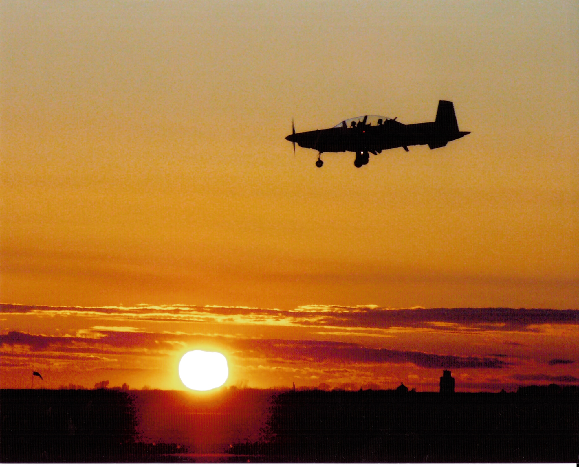 Capturing this T-6 Texan returning to Vance Air Force Base at sunset netted Terry Crawford, 71st Logistic Readiness Squadron commander's secretary, a first place win in a base photo contest. The Heritage to Horizons contest was part of Vance's observance of the Air Force's 60th anniversary.