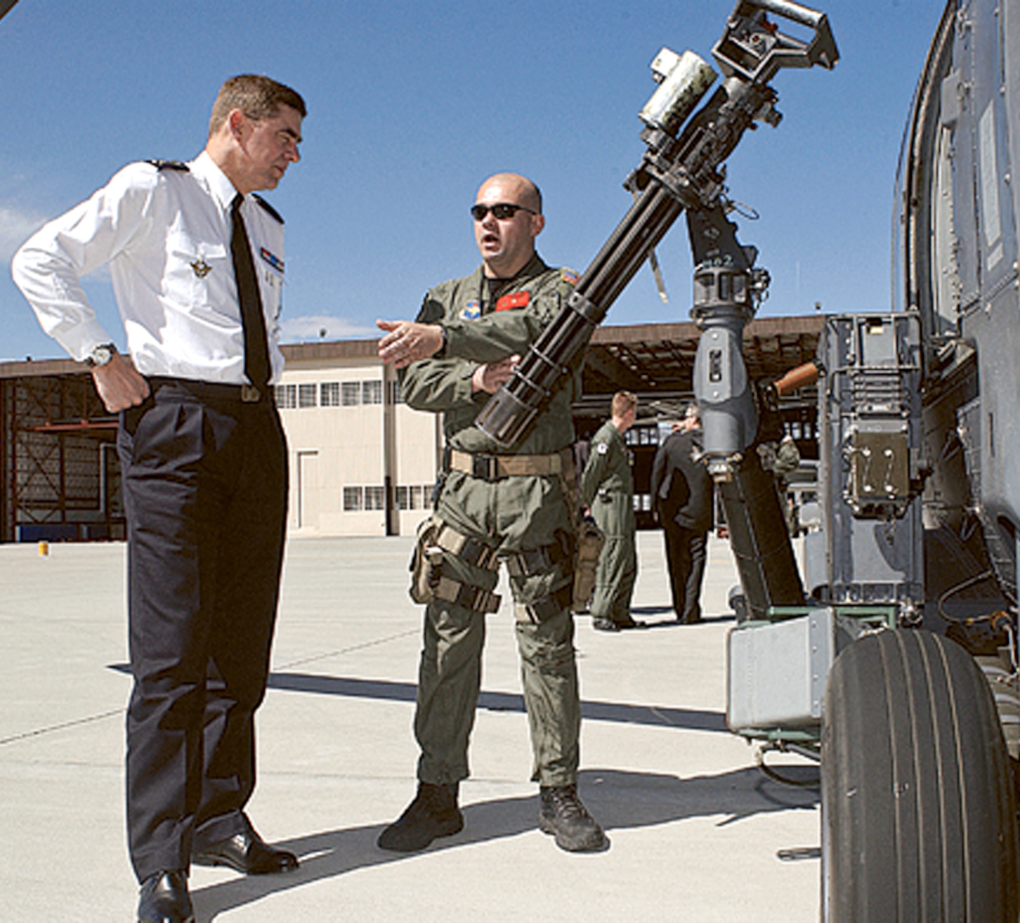 Gen. St?phane Abrial, chief of staff of the French air force, speaks to Tech. Sgt. Eric Barker, an aerial gunner instructor with the 58th Special Operations Wing, about the HH-60 Pave Hawk here. The general visited Kirtland AFB April 4 and toured various units around the base. The 58th Special Operations Wing and the Air Force Operational Test and Evaluation Center helped to make sure the visit went off without a hitch. (U.S. Air Force photo by Todd Berenger)                               