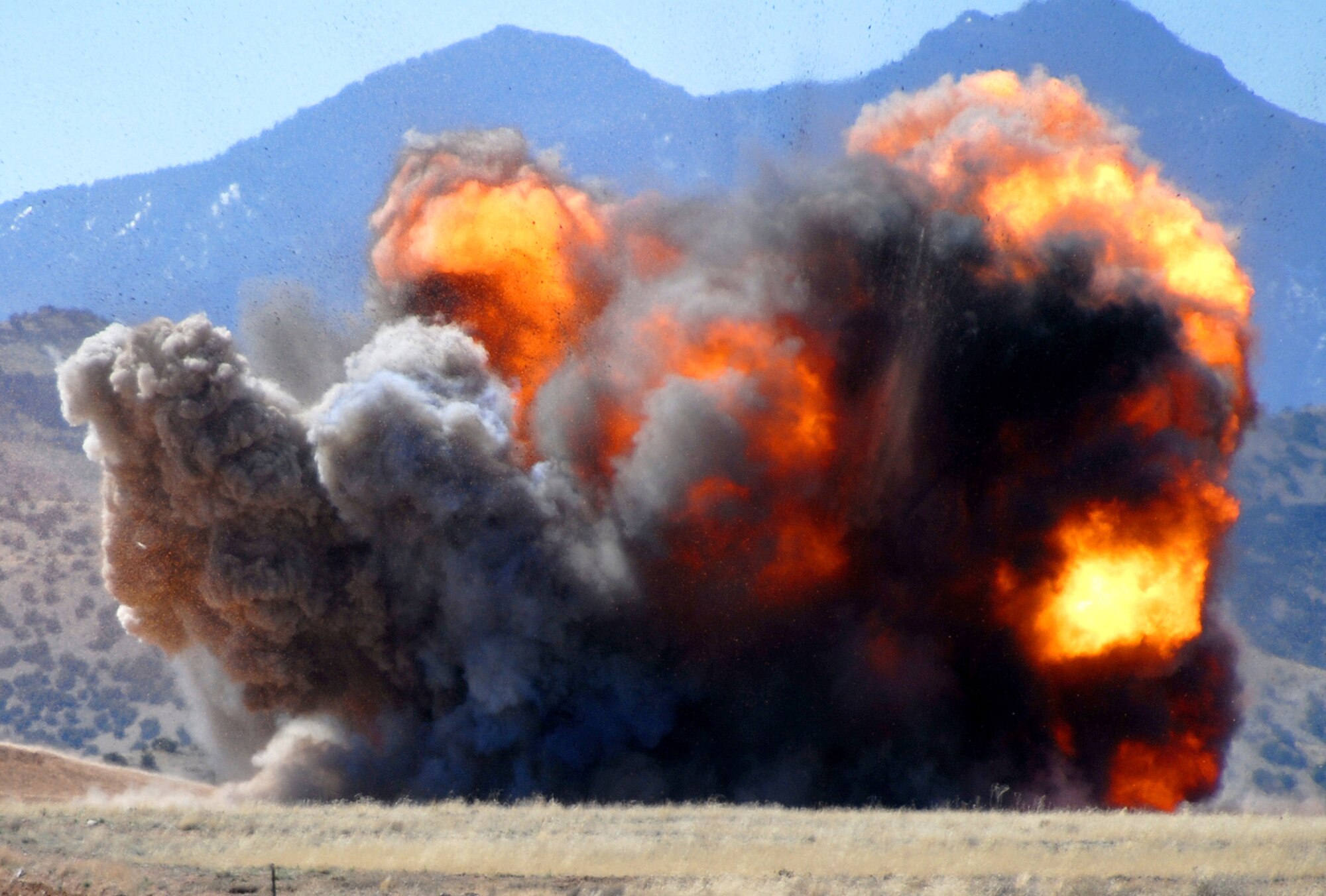 EOD detonates old rocket motors in a remote part of Kirtland AFB. (U.S. Air Force photo by Staff Sgt. Markus M. Maier)