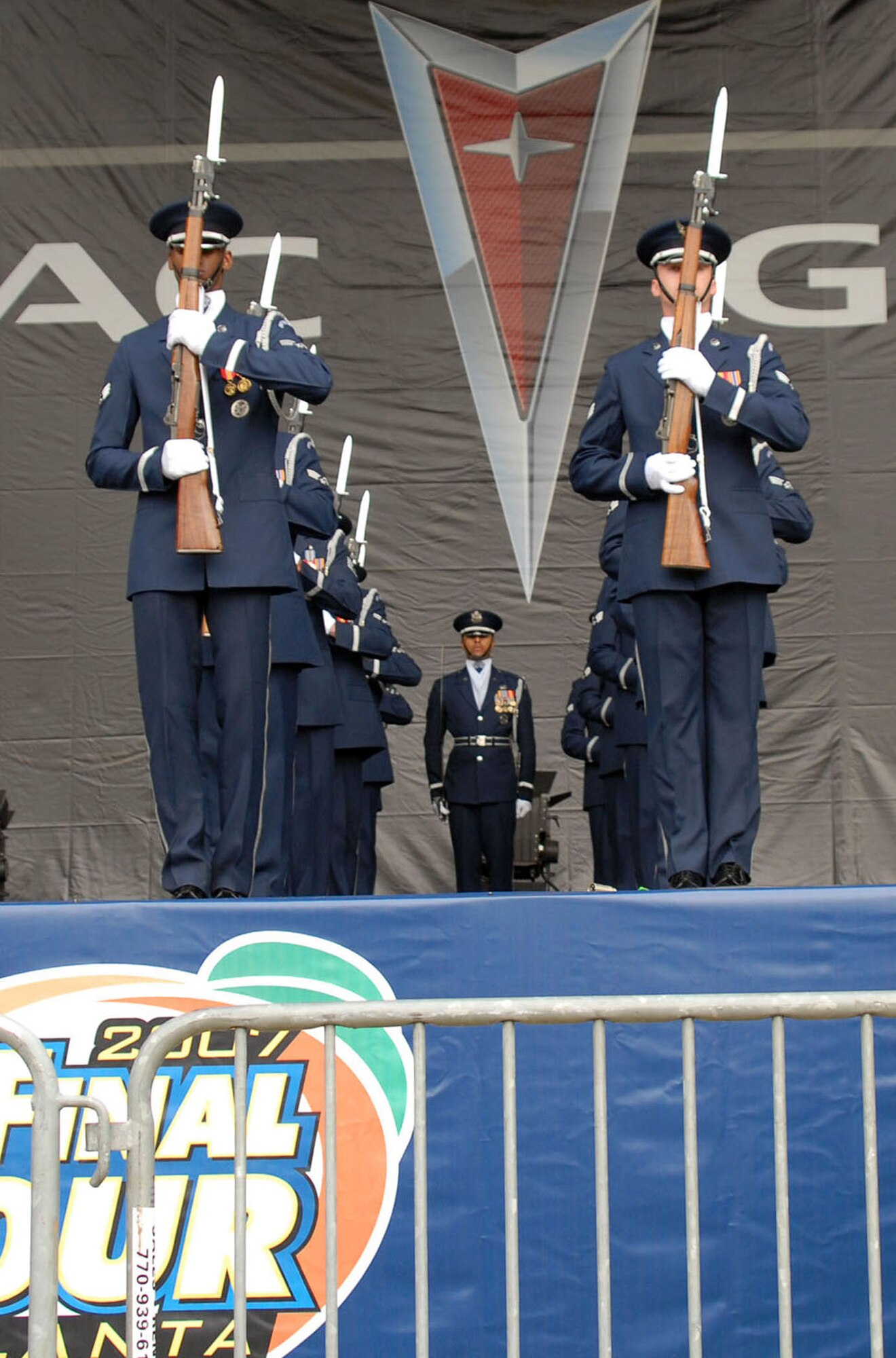 Air Force Honor Guard Drill Team members perform at the opening ceremonies for the NCAA Final Four games at Centennial Olympic Park March 31in Atlanta.  The drill team was invited to perform at events and ceremonies surrounding the Final Four Games March 31-April 2. The drill team recently returned from their latest 11-day tour around the U.S., that included visits to Atlanta; Hill Air Force Base, Utah; and Salt Lake City. (U.S. Air Force photo/Staff Sgt. Madelyn Waychoff)