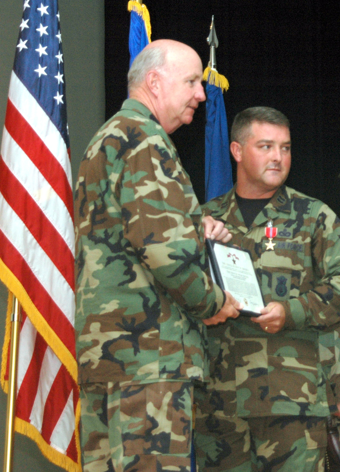 Maj. Gen. Thomas Deppe, 20th Air Force commander, poses with Capt. Johnathan Bennett, 741st Missile Security Forces Squadron operations officer, after presenting him with the Bronze Star Medal Sept. 14, 2006, for duties performed in Iraq.