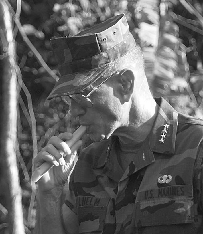 At Peru's riverine training center near Iquitos, Marine Corps Gen. Charles Wilhelm samples a native plant that can provide life-saving nourishment during anti-drug operations deep in the Amazon rainforest. Sponsored by DoD, the camp has already trained dozens of Peruvian naval and law enforcement specialists who will help the country stop narcotraffickers' use of the Amazon River. Wilhelm, commander in chief of the U.S. Southern Command, visited the camp in early December 1997. Douglas J. Gillert 9801094e.djg The isolated ground-based radar site near Iquitos, Peru, operated by Detachment 4, 24th Operations Group, Howard Air Force Base, Panama, provides the eyes of anti-drug operators stemming the flow of Peruvian coca leaves to Colombian cocaine processing plants. Thirty-three U.S. airmen and six Peruvian enlisted controllers staff the high-tech compound, located on a bluff above the Amazon River. Douglas J. Gillert