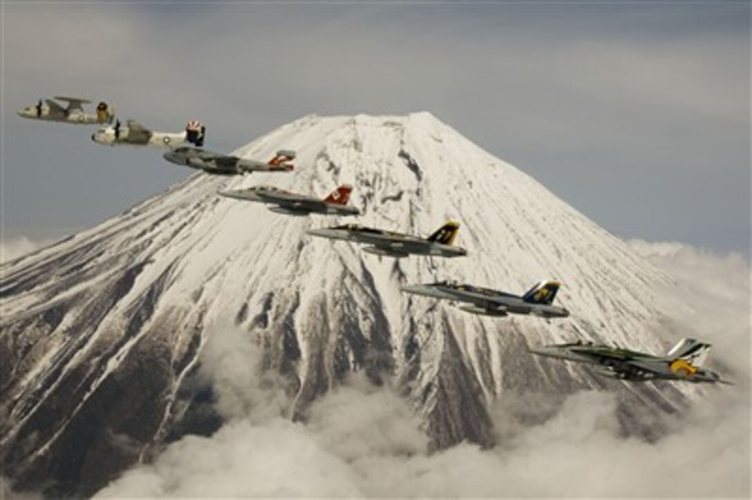 U.S. Navy aircraft from Carrier Air Wing 5 perform a formation flight in front of Mount Fuji, Japan, April 12, 2007. Nine squadrons are assigned to the air wing and embarked aboard USS Kitty Hawk.  The squadrons operate from Naval Air Facility Atsugi, Japan. Kitty Hawk operates out of Fleet Activities Yokosuka, Japan.