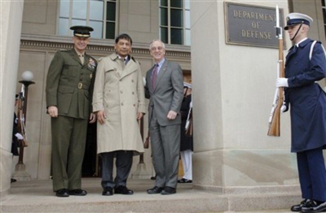Deputy Defense Secretary Gordon England (right) hosts an Honor Cordon in honor of Indonesian Minister of Defense Juwono Sudarsono (center)  April 16, 2007.  Accompanying them is Chairman of the Joint Chiefs of Staff U.S. Marine Gen. Peter Pace (left).