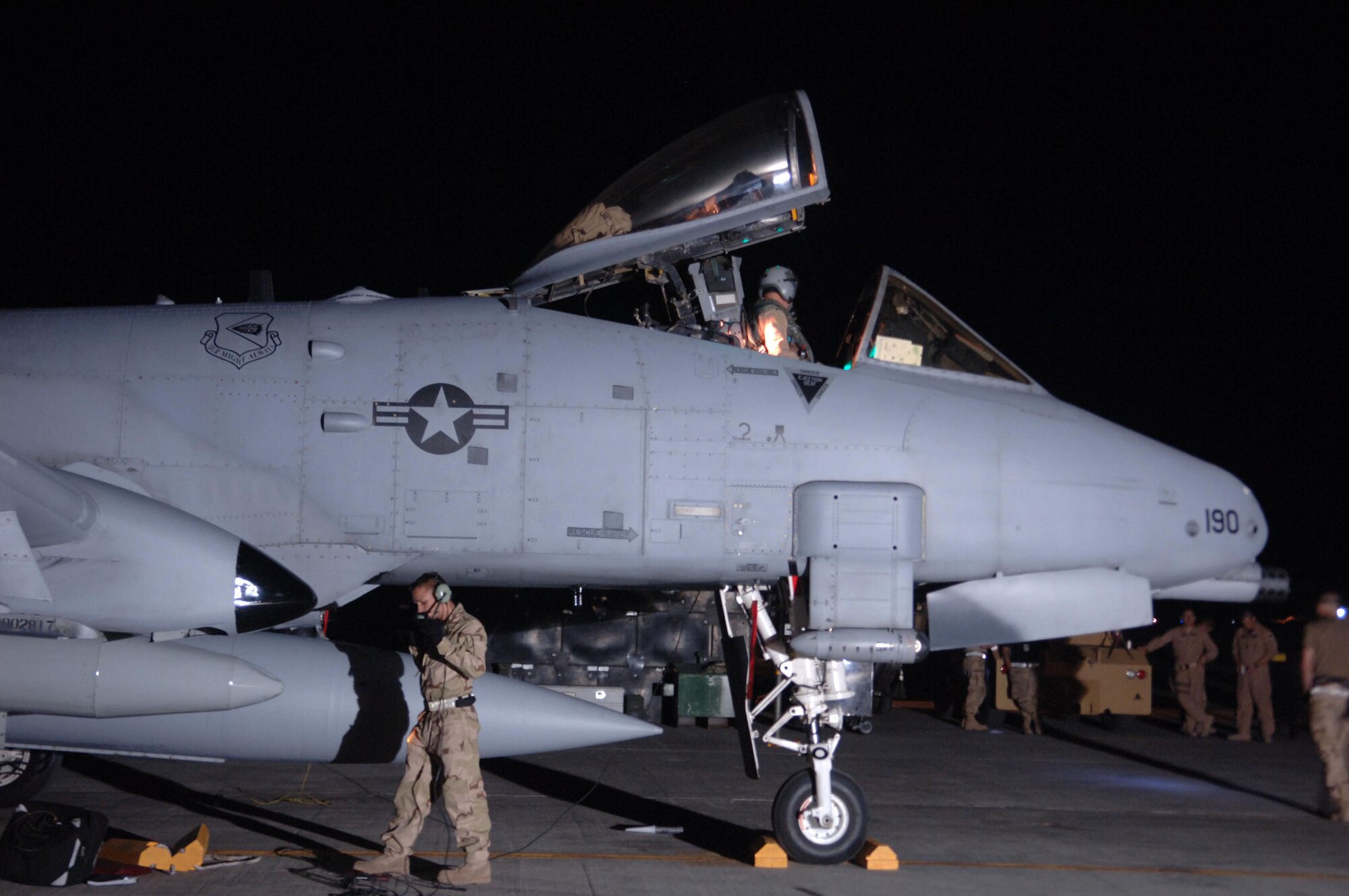 Aircrew wait to greet an arriving pilot while maintainers recover an A-10 after it is parked on the ramp at Bagram Airfield April 17. The arrival of the A-10s adds a second fighter squadron to the 455th Air Expeditionary Wing. (U.S. Air Force photo/Staff Sgt. Kevin Tomko)
