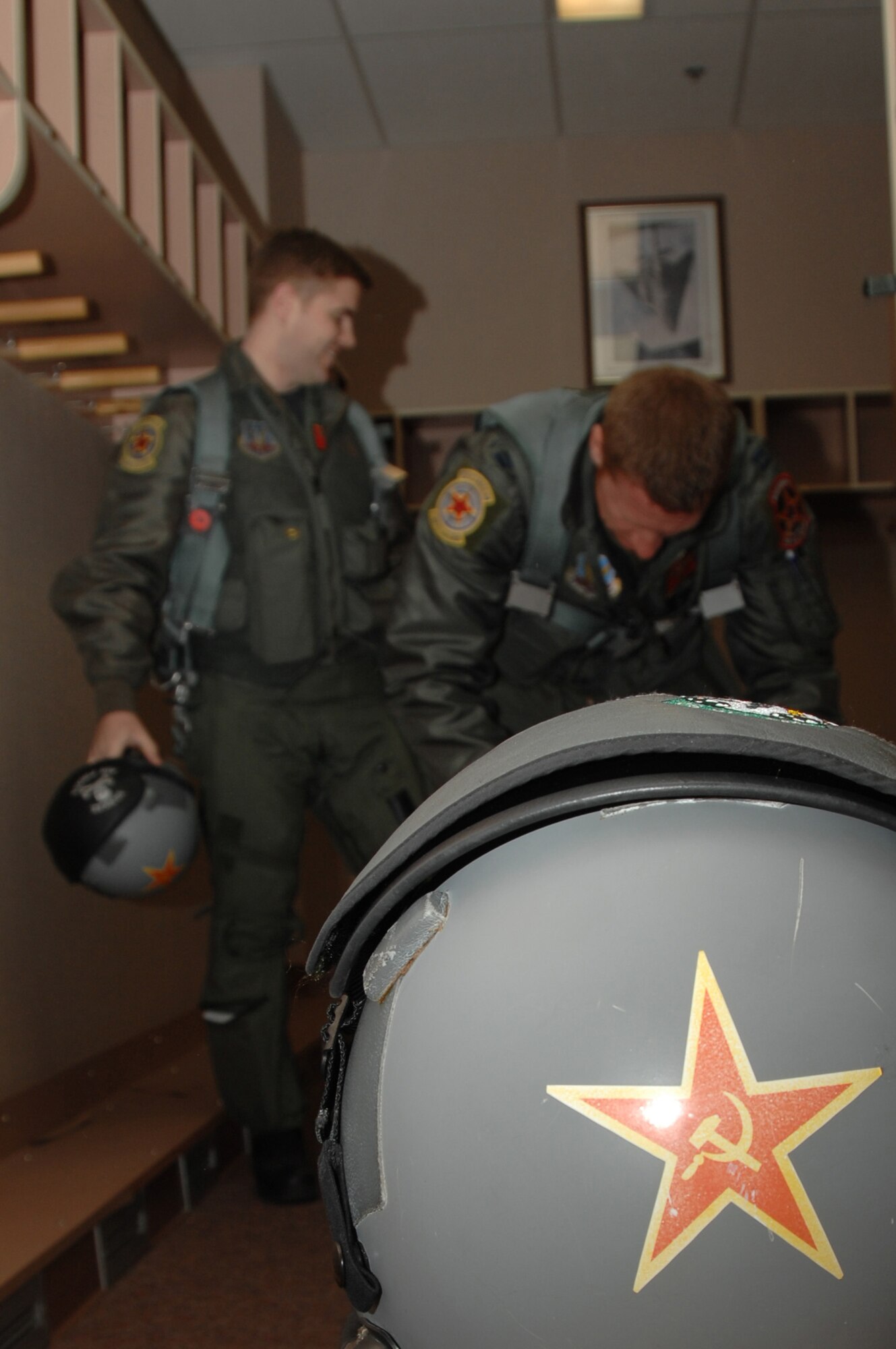 EIELSON AIR FORCE BASE, Alaska -- Two F-16 Fighting Falcon pilots from the 64th Aggressor Squadron, Nellis Air Force Base, Nevada get suited up prior to a mission during Red Flag-Alaska 07-1. Red Flag-Alaska is a Pacific Air Forces-directed field training exercise for U.S. forces flown under simulated air combat conditions. It is conducted on the Pacific Alaskan Range Complex with air operations flown out of Eielson and Elmendorf Air Force Bases. (U.S. Air Force Photo by Staff Sgt Joshua Strang)