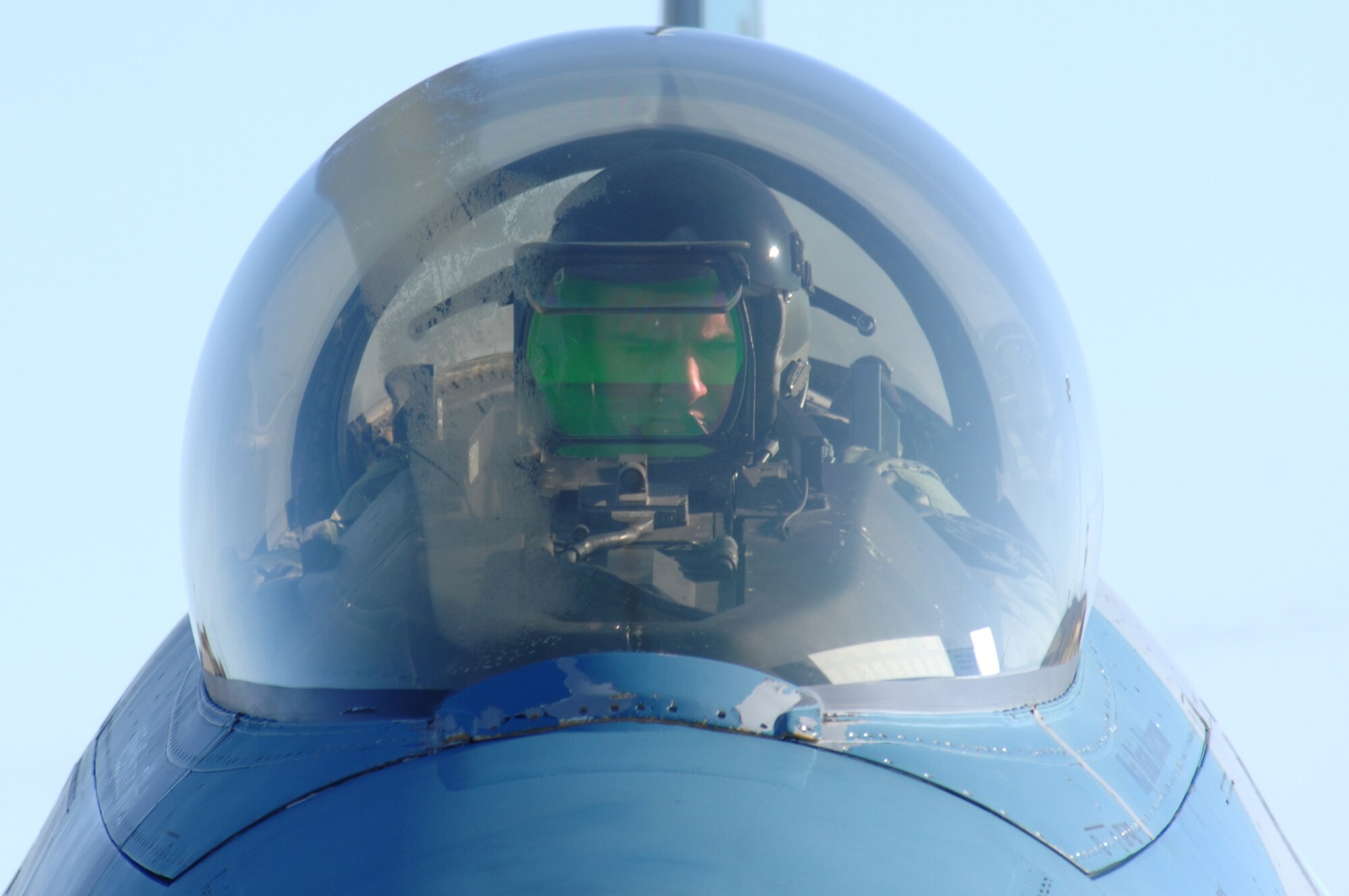 EIELSON AIR FORCE BASE, Alaska -- An F-16 Fighting Falcon pilot from the 64th Aggressor Squadron, Nellis Air Force Base, Nevada waits to taxi during Red Flag-Alaska 07-1. Red Flag-Alaska is a Pacific Air Forces-directed field training exercise for U.S. forces flown under simulated air combat conditions. It is conducted on the Pacific Alaskan Range Complex with air operations flown out of Eielson and Elmendorf Air Force Bases. (U.S. Air Force Photo by Staff Sgt Joshua Strang)