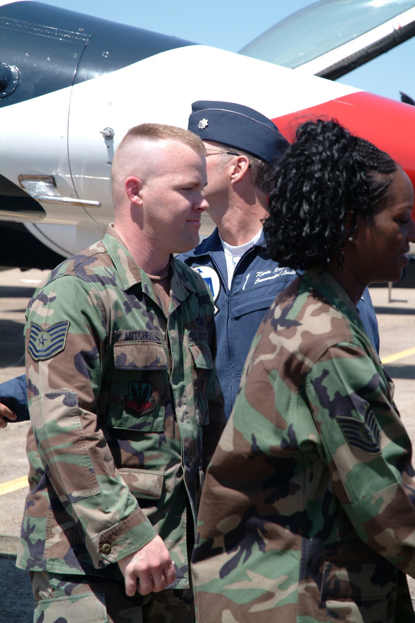 EGLIN AIR FORCE BASE, Fla. -- Tech. Sgt. Roger Mitchell, 29th Training Systems Squadron, shakes hands of on-lookers after his re-enlistment ceremony April 13. Lt. Col. Kevin Robbins, U.S. Air Force Thunderbird commander, administered the enlisted oath to Sgt.  Mitchell and six other Eglin members before the Eglin practice air show. The other Eglin members re-enlisting in the Air Force are: Tech. Sgt. Travis L. Harrington, 46th Weather Squadron; Tech. Sgt. Destry Skweres, 96th Logistics Readiness Squadron; Staff Sgt. Chassity Ware, 33rd Maintenance Group; Staff Sgt. Cory Riley, 780th Test Squadron; Staff Sgt. Dale Sowers, 96th Communications Squadron; and Airman 1st Class John Henry, 96th Logistics readiness Squadron. (Photo by Tech. Sgt. Andrew Leonhard)