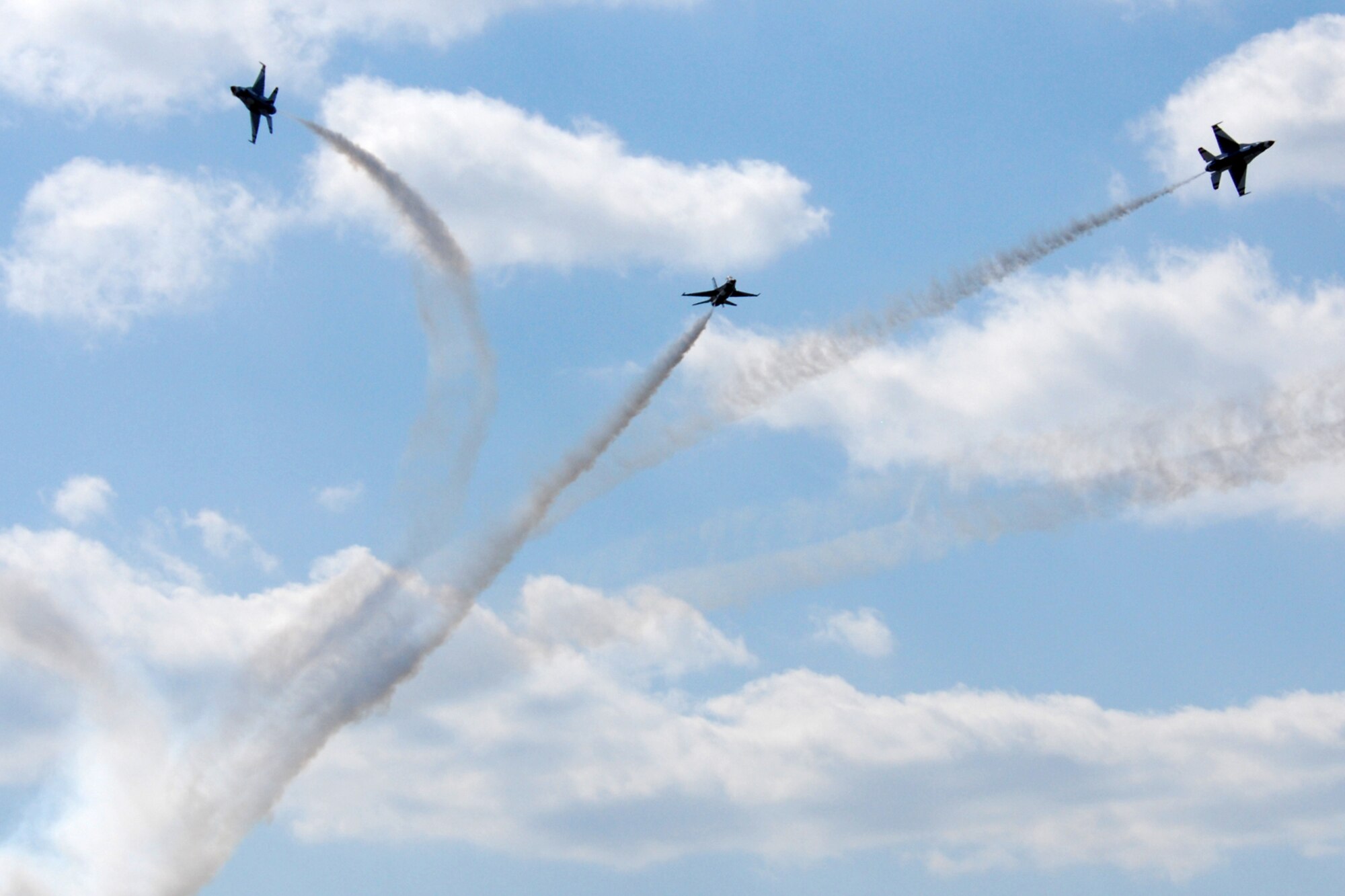 EGLIN AIR FORCE BASE, Fla. -- The U.S. Air Force Thunderbirds break for a "low bomb burst" maneuver during the 2007 Eglin Air Show here April 15. The Thunderbirds' performance concluded the air show weekend that was cut show by a severe weather cancellation. The first day of the air show was cancelled for safety reasons due to a severe weather threat. The winds on the back side of the storm didn't keep spectators away April 15 as the Thunderbirds preformed in front of thousands of spectators to culminate the air show. (U.S. Air Force photo by Staff Sgt. Mike Meares)
