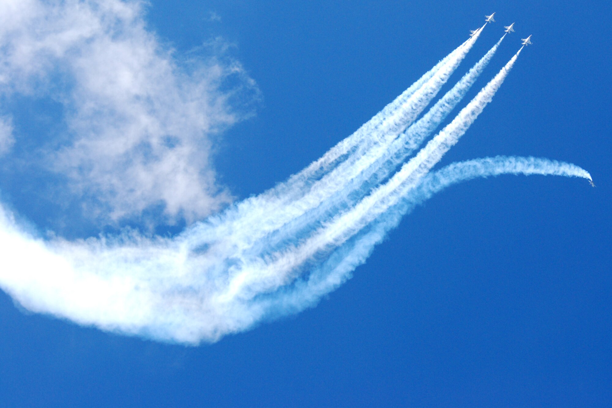 EGLIN AIR FORCE BASE, Fla. -- The F-16 Fighting Falcons of the U.S. Air Force Air Demonstration Squadron, the Thunderbirds, demonstrate the capabilities of their aircraft during the 2007 Eglin Air Show April 15. The first day of the air show was cancelled for safety reasons due to a severe weather threat. More than 42,000 spectators were in attendance April 15.  (U.S. Air Force photo by Staff Sgt. Mike Meares)