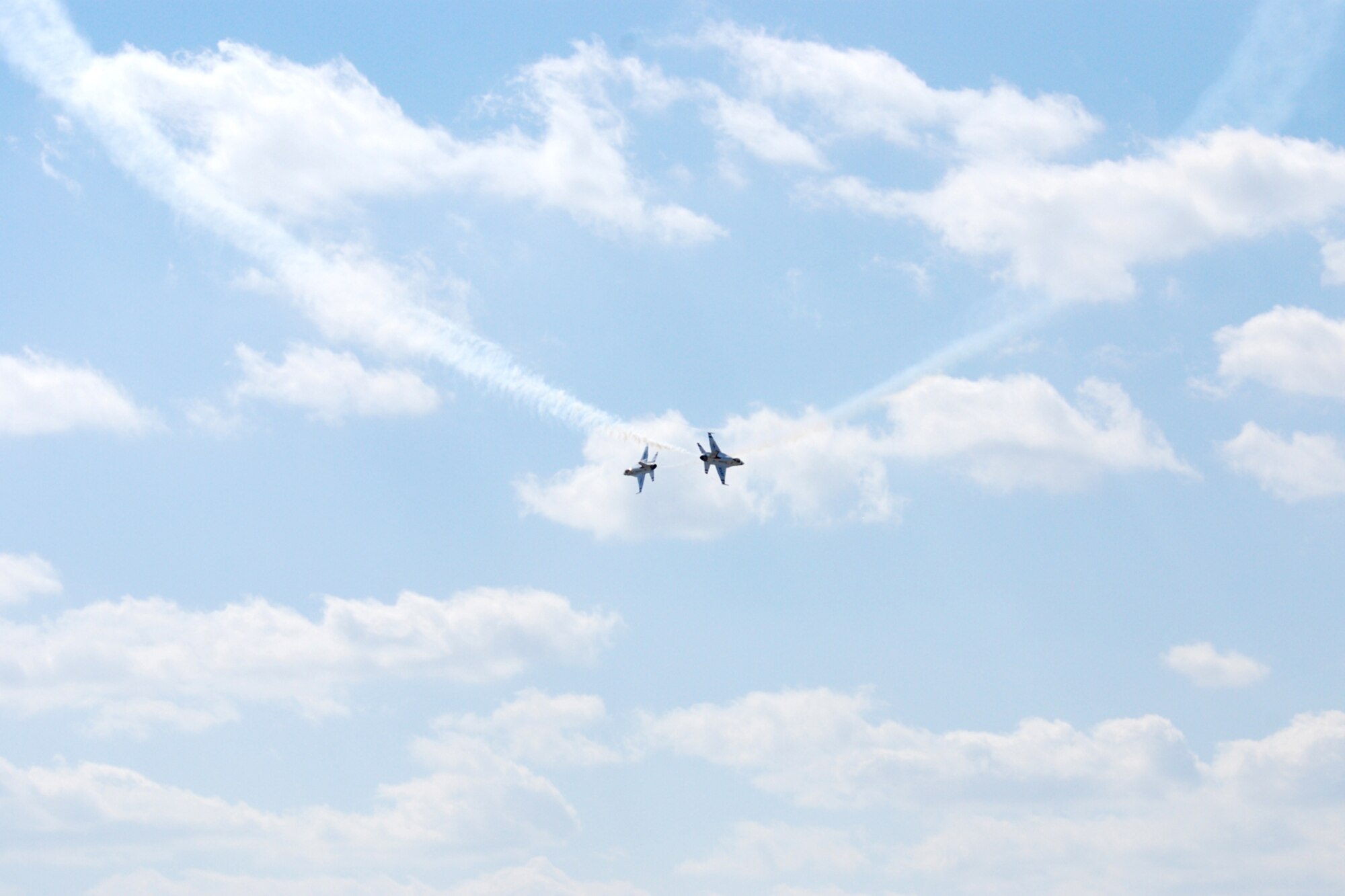 EGLIN AIR FORCE BASE, Fla. -- The U.S. Air Force Thunderbirds flight demonstration team crosses over the flightline during the 2007 Eglin Air Show here April 15. The first day of the air show was cancelled for safety reasons due to a severe weather threat. The winds on the back side of the storm didn't keep spectators away April 15 as the Thunderbirds performed in front of thousands of spectators to culminate the air show. The Thunderbirds are assigned to the U.S. Air Force Air Demonstration Squadron at Nellis Air Force Base, Nev. (U.S. Air Force photo by Staff Sgt. Mike Meares)