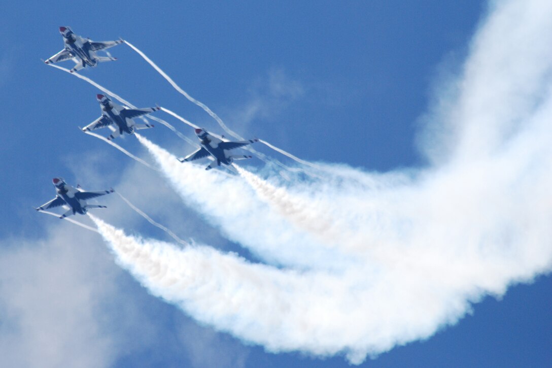 EGLIN AIR FORCE BASE, Fla. -- F-16 Fighting Falcons of the U.S. Air Force Air Demonstration Squadron, the Thunderbirds, demonstrate the capabilities of their aircraft during the 2007 Eglin Air Show April 15. The first day of the air show was cancelled for safety reasons due to a severe weather threat. The winds on the back side of the storm didn't keep more than 42,000 spectators away April 15 as the Thunderbirds preformed to culminate the air show. (U.S. Air Force photo by Staff Sgt. Mike Meares)