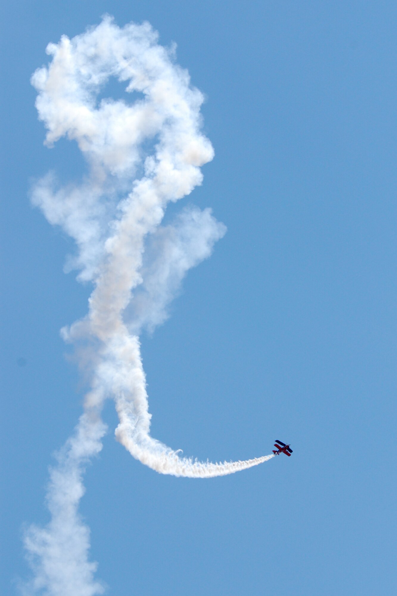 EGLIN AIR FORCE BASE, Fla. -- Ed Hamill, pilot of the Air Force Reserves Biplane, performs at the 2007 Eglin Air Show April 15. His aerial acrobatics, Living the Dream air show, dives and rolls through three acts: Barnstormers, Competitors and Skydancers. The routine began with a tribute to the first flight at Kitty Hawk, N.C., and finished with a skydancing performance. More than 42,000 were estimated to attend the air show April 15. (U.S. Air Force photo by Staff Sgt. Mike Meares)