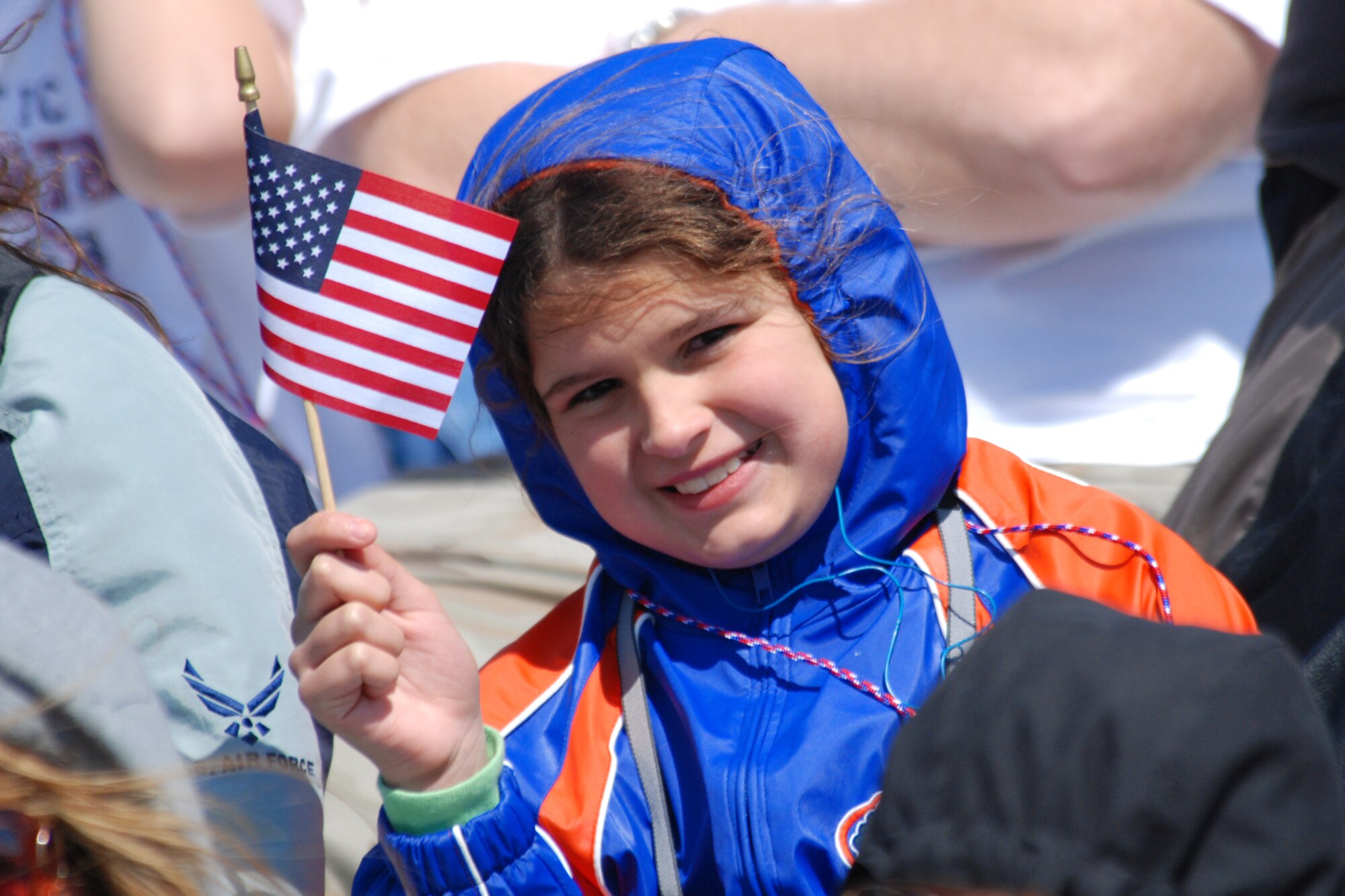 EGLIN AIR FORCE BASE, Fla. -- Chelsea Bailey, 10, of Winter Haven, Fla., waves an American Flag during the Thunderbird?s aerial performance at the 2007 Eglin Air Show April 15. This was the first time she has ever watched the Thunderbirds perform their demonstration. Lt. Col. Kevin Robbins, U.S. Air Force Thunderbird commander and Thunderbird 1, is also from Winter Haven. (U.S. Air Force photo by Staff Sgt. Mike Meares)