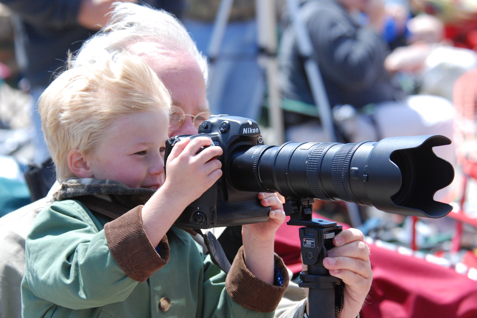 EGLIN AIR FORCE BASE, Fla. -- Mike Cage, of Crestview, teaches his son Greyson, 5, how to photograph the high speed action of the Thunderbirds during the 2007 Eglin Air Show April 15. The first day of the air show was cancelled due to severe weather coming into the area. Although the second day was cold and windy, thousands braved the elements to watch the aerial acrobatics in the skies over Eglin. (U.S. Air Force photo by Staff Sgt. Mike Meares)