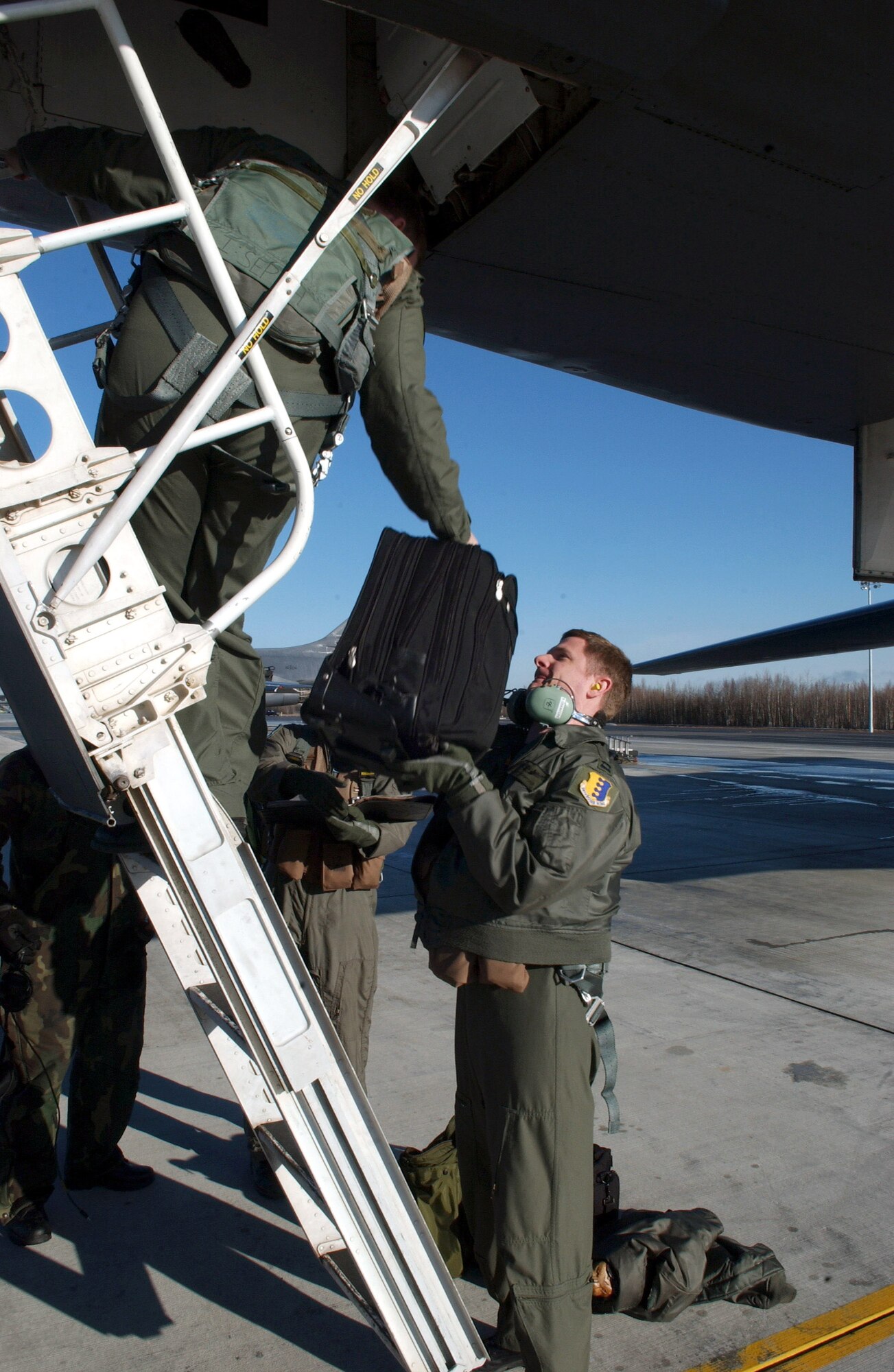 Captains Brian Crawford and Nate Quinlan load bags into a B-1B Lancer April 13 at Eielson Air Force Base, Alaska, during Red Flag-Alaska 07-1. Red Flag-Alaska is a Pacific Air Forces-directed field training exercise for U.S. forces flown under simulated air combat conditions. It is conducted on the Pacific Alaskan Range Complex with air operations flown out of Eielson and Elmendorf Air Force Bases. The captains are 37th Bomb Squadron pilots from Ellsworth AFB, S.D. (U.S. Air Force photo/Airman 1st Class Jonathan Snyder)