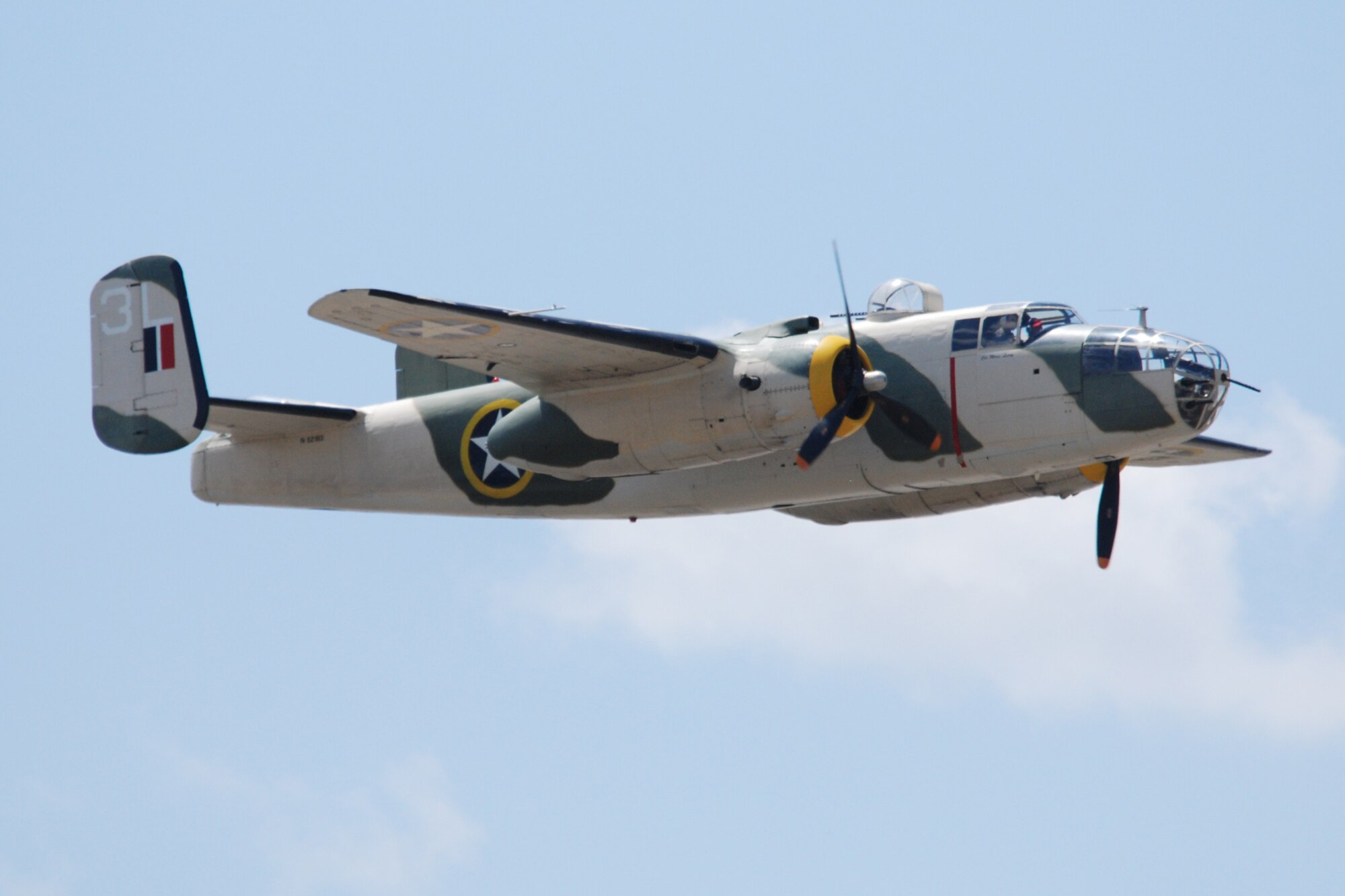 EGLIN AIR FORCE BASE, Fla. -- One of three B-25s performs fly-bys at the 2007 Eglin Air Show April 15. Eglin was the secret training site for Lt. Col. James "Jimmy" Doolittle and his raiders in March 1942. To commemorate the 65th anniversary of the Doolittle Raid on Japan and the role played by then Eglin Field in that secret mission, U.S. Air Force and Congressional leaders and local Doolittle Raider, retired Master Sgt. Ed Horton, dedicated a historical marker to the Doolittle Raiders on Field Auxiliary 1 before the Thunderbirds' aerial demonstration at the 2007 Eglin Air Force Base Air Show April 15. The B-25 achieved worldwide fame on April 18, 1942 when sixteen B-25's, under the command of Lt. Col. James Doolittle, were launched from the aircraft carrier Hornet in a daring raid on five Japanese cities including Tokyo, Osaka, Yokohama, Nagoya, and Kobe. (U.S. Air Force photo by Staff Sgt. Mike Meares)